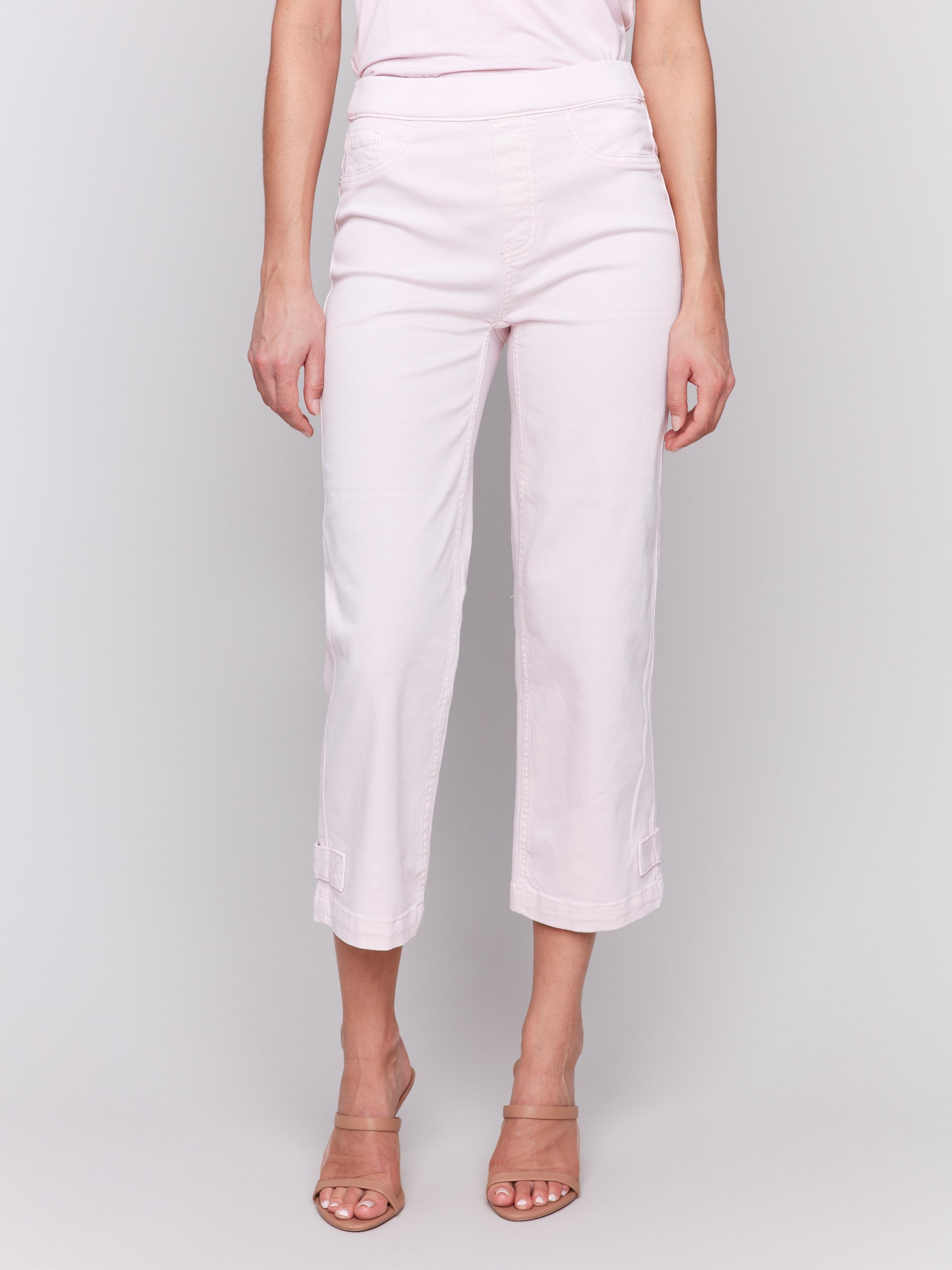 Cropped length pink pants featuring two back pockets, by Charlie B.