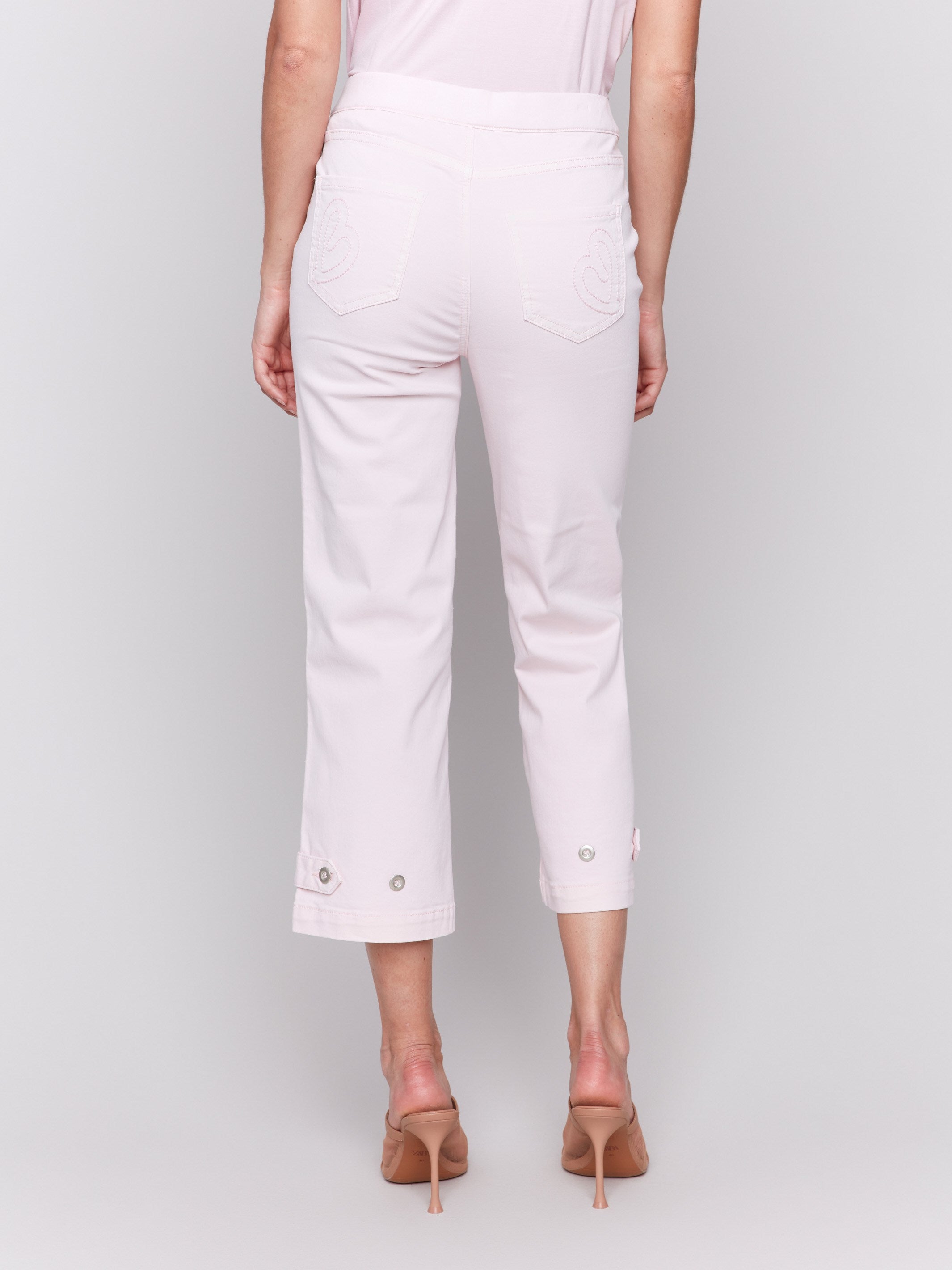 Pink twill pants showcasing two faux front pockets, by Charlie B.