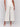 Beige cropped wide-leg pants with a side zipper, styled with a white top and beige heels by Charlie B.