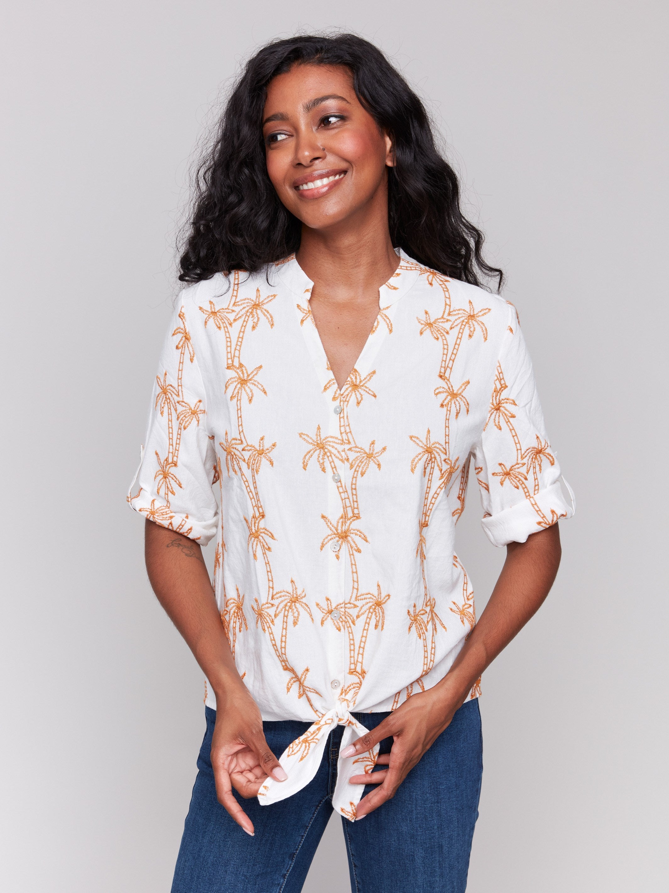 Papaya blouse with a V-neckline and palm tree embroidery by Charlie B.