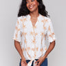 Papaya blouse with a V-neckline and palm tree embroidery by Charlie B.