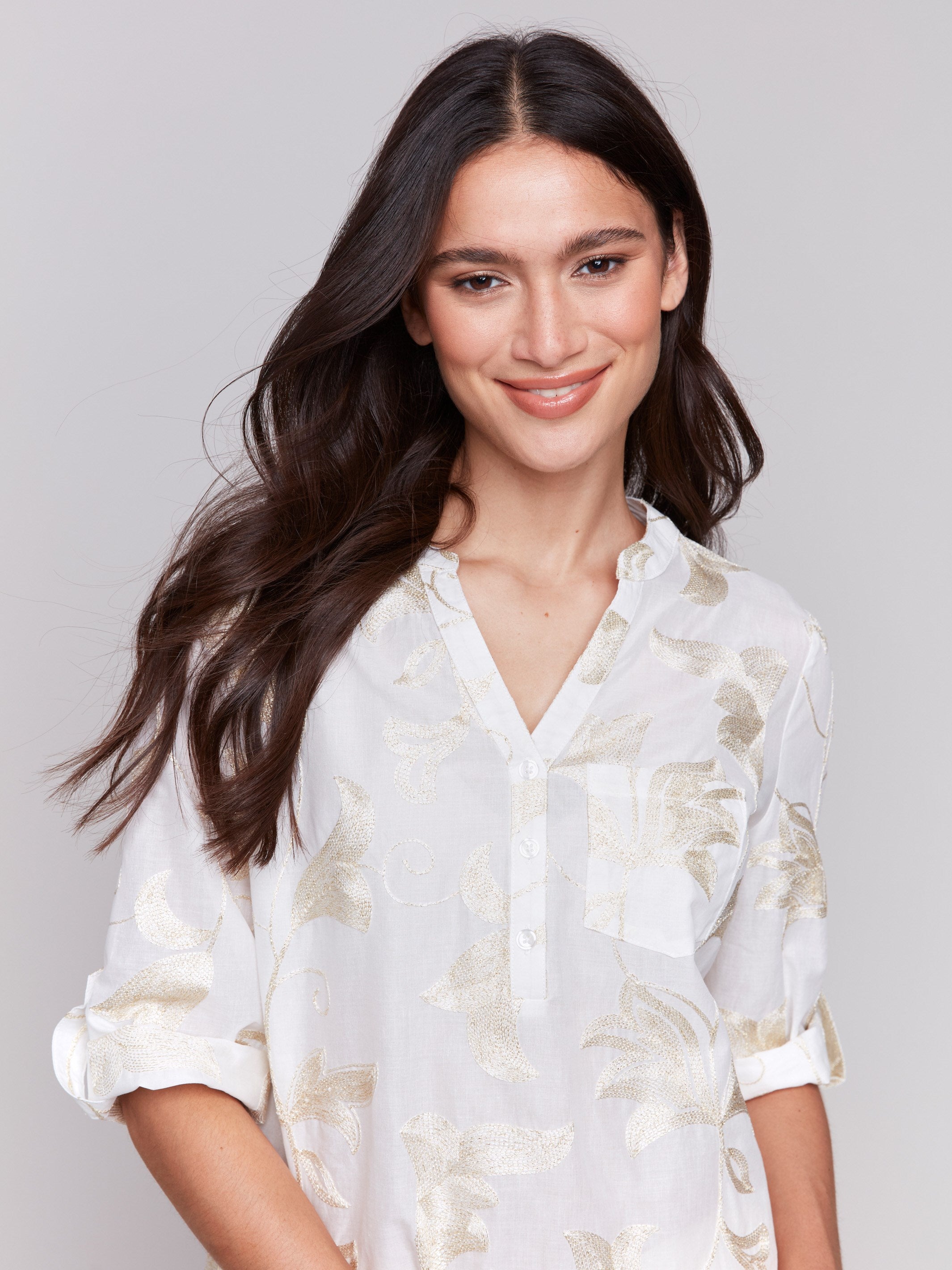 White blouse featuring adjustable 3/4 roll-up sleeves by Charlie B.