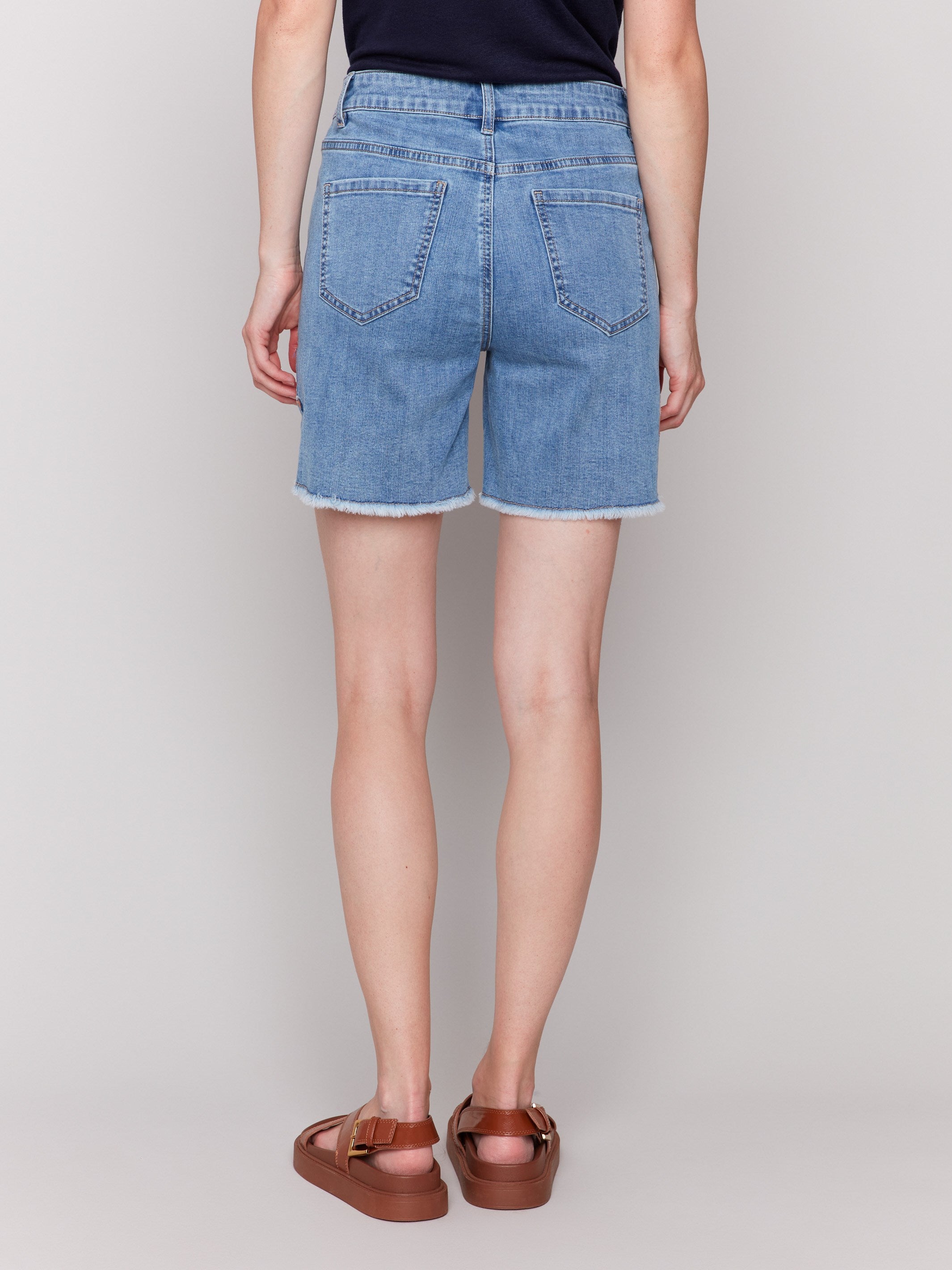 Shorts with a fashionable fringed hem detail by Charlie B.