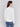 White sweater with floral embroidery, long sleeves, and a round neckline by Charlie B.