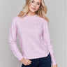 Light pink sweater with floral embroidery, long sleeves, and a crew neckline by Charlie B.