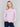 Light pink sweater with floral embroidery, long sleeves, and a crew neckline by Charlie B.