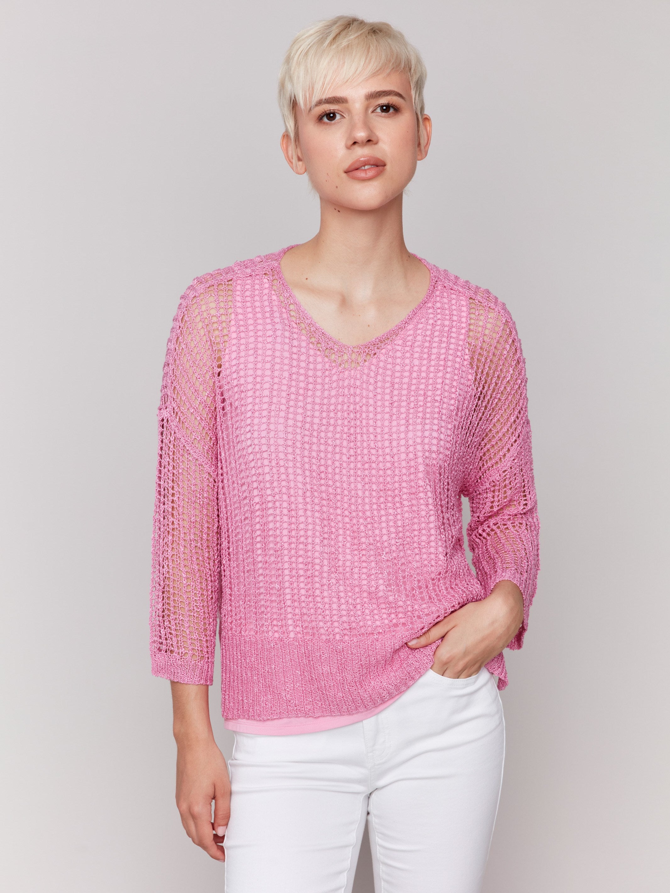 Begonia pink fishnet crochet sweater with a relaxed V-neck by Charlie B.