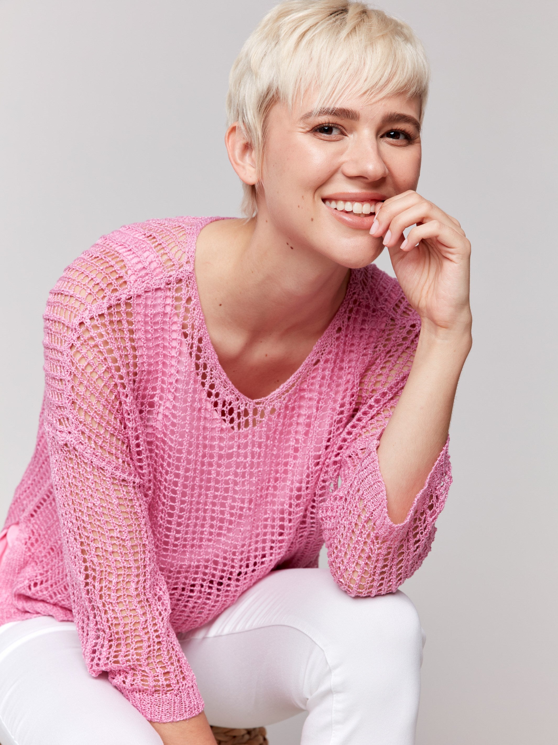 Sweater featuring drop shoulder design in begonia pink by Charlie B.