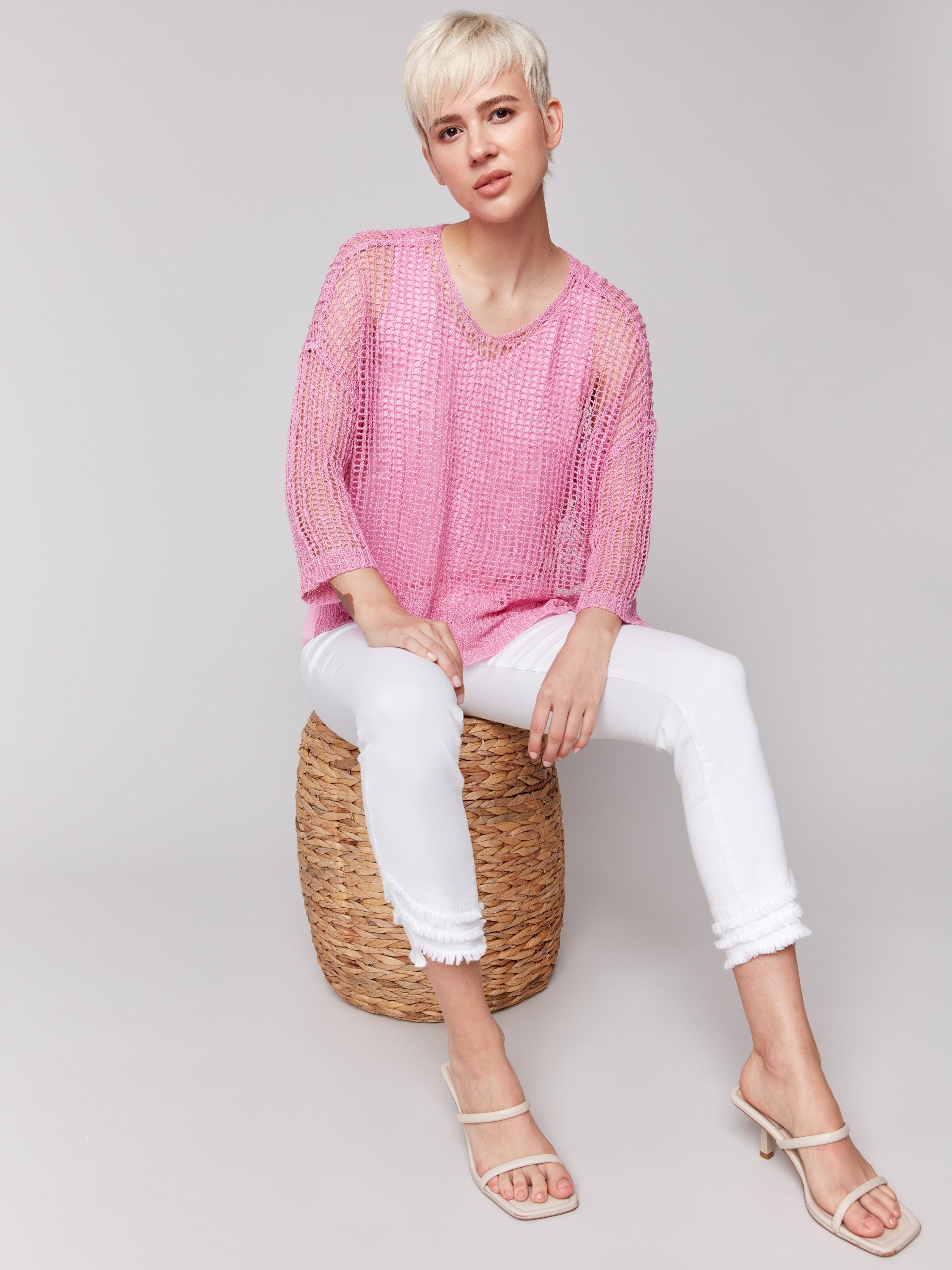 Fishnet crochet sweater with loose fit in begonia pink by Charlie B.