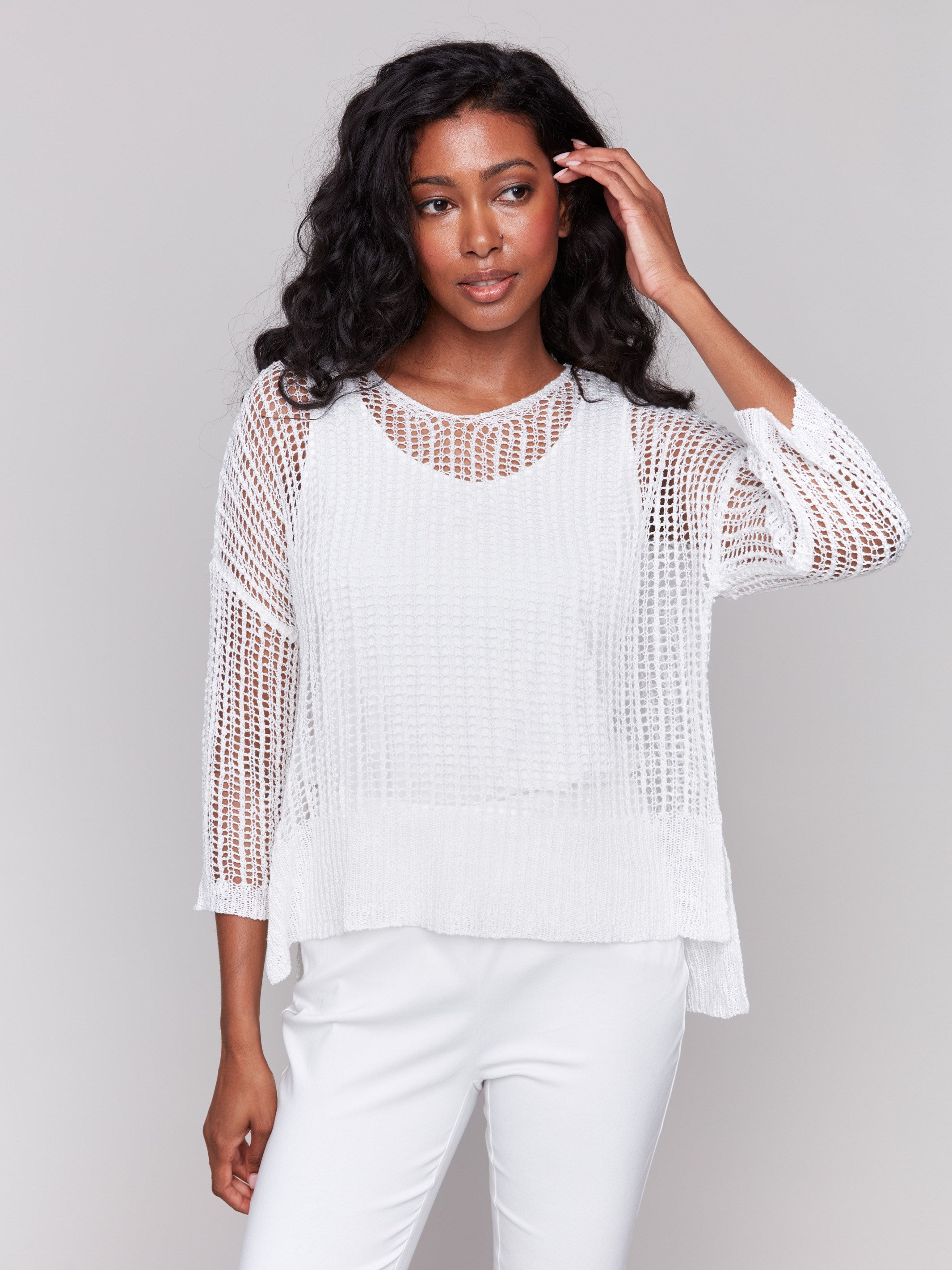 White fishnet crochet sweater with loose fit by Charlie B.