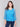 Lagoon blue sweater with a relaxed V-neck design by Charlie B.