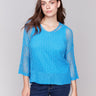 Lagoon blue sweater with a relaxed V-neck design by Charlie B.