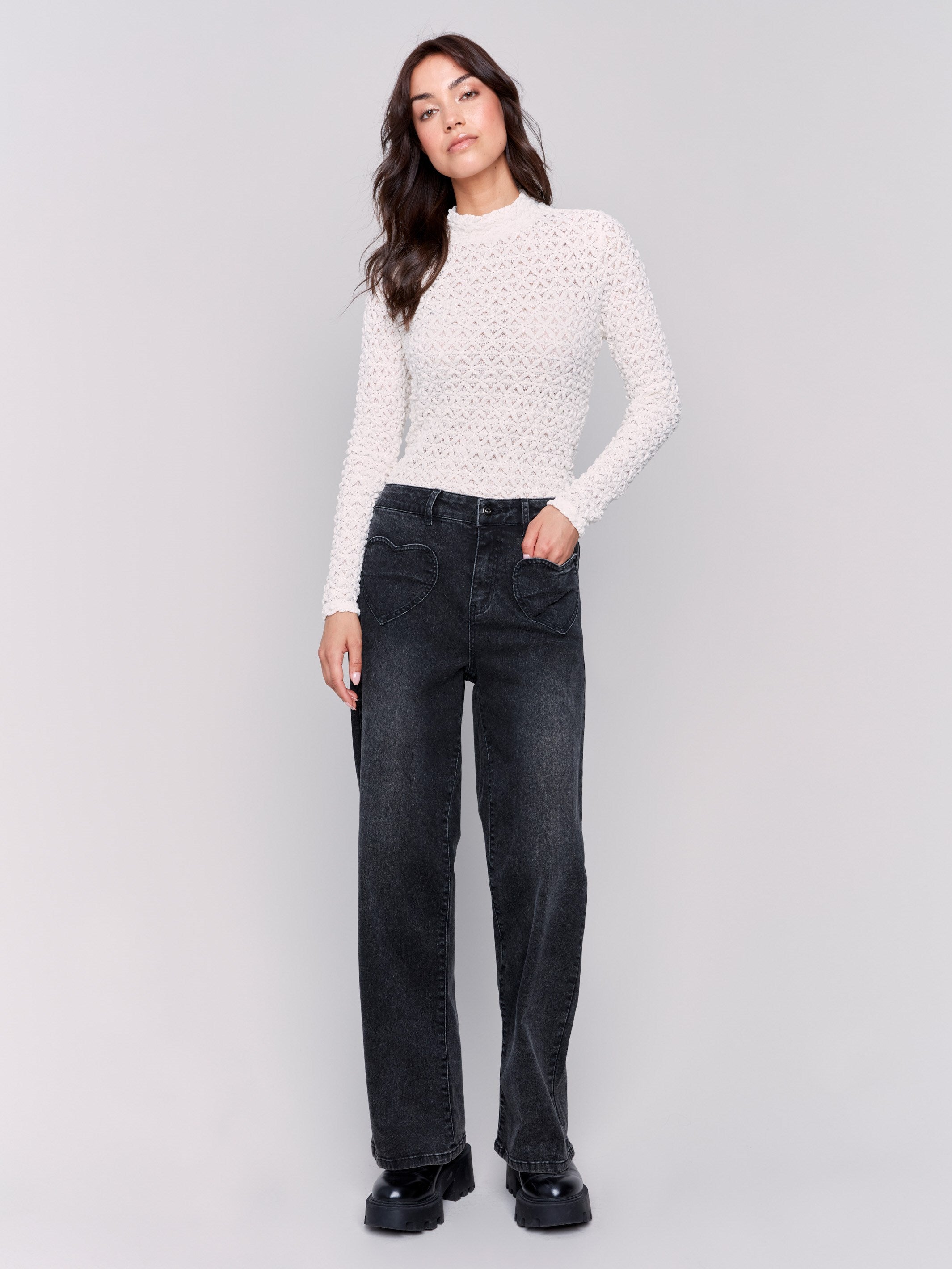 Charcoal-colored flare jeans with heart-shaped front pockets, regular rise, and flare leg by Charlie B.