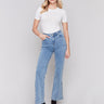 Light blue flare jeans with side button detailing, featuring a regular rise and classic five-pocket design by Charlie B.