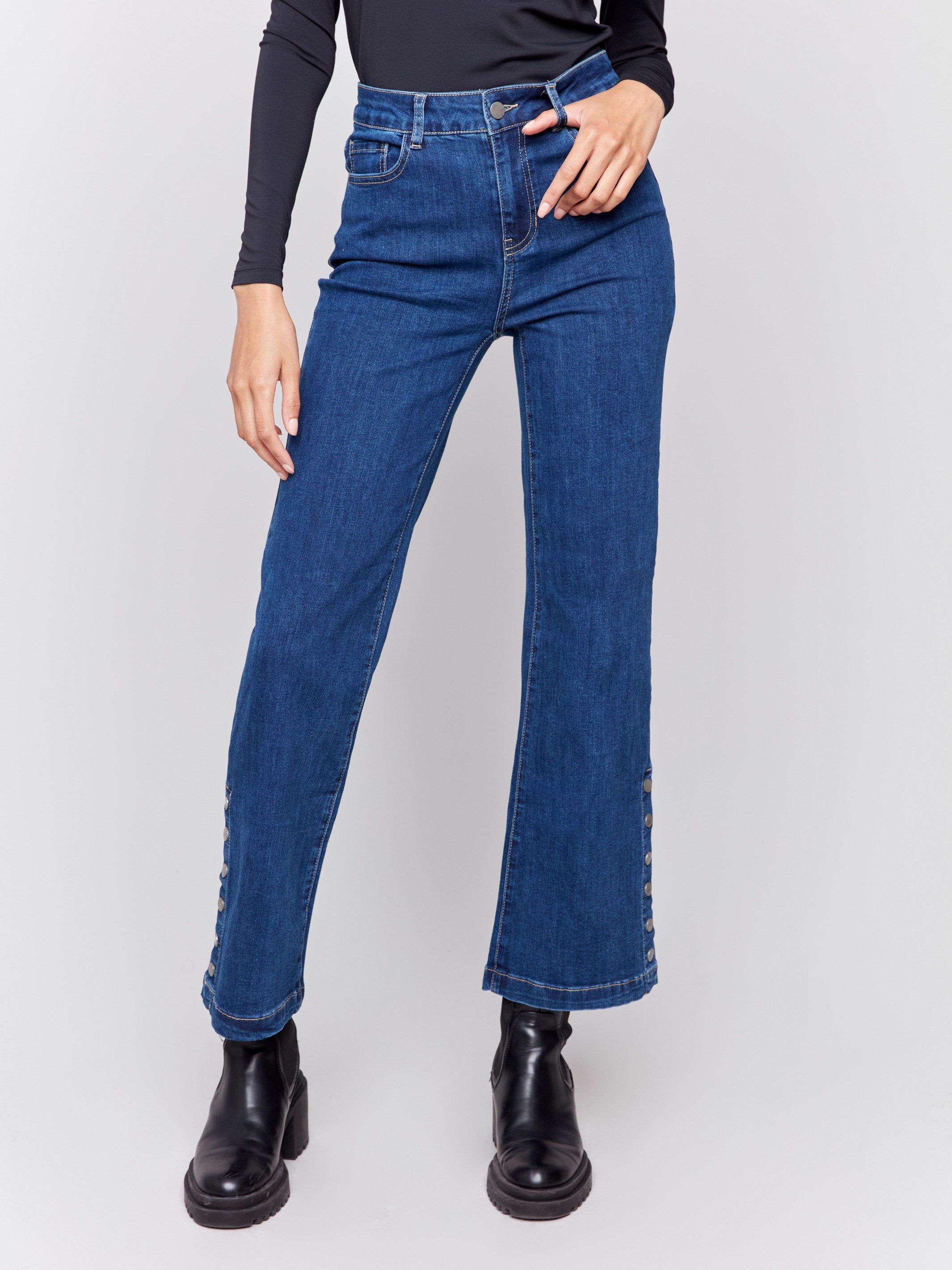 Indigo blue flare jeans with side button detailing, featuring a regular rise and classic five-pocket design by Charlie B.