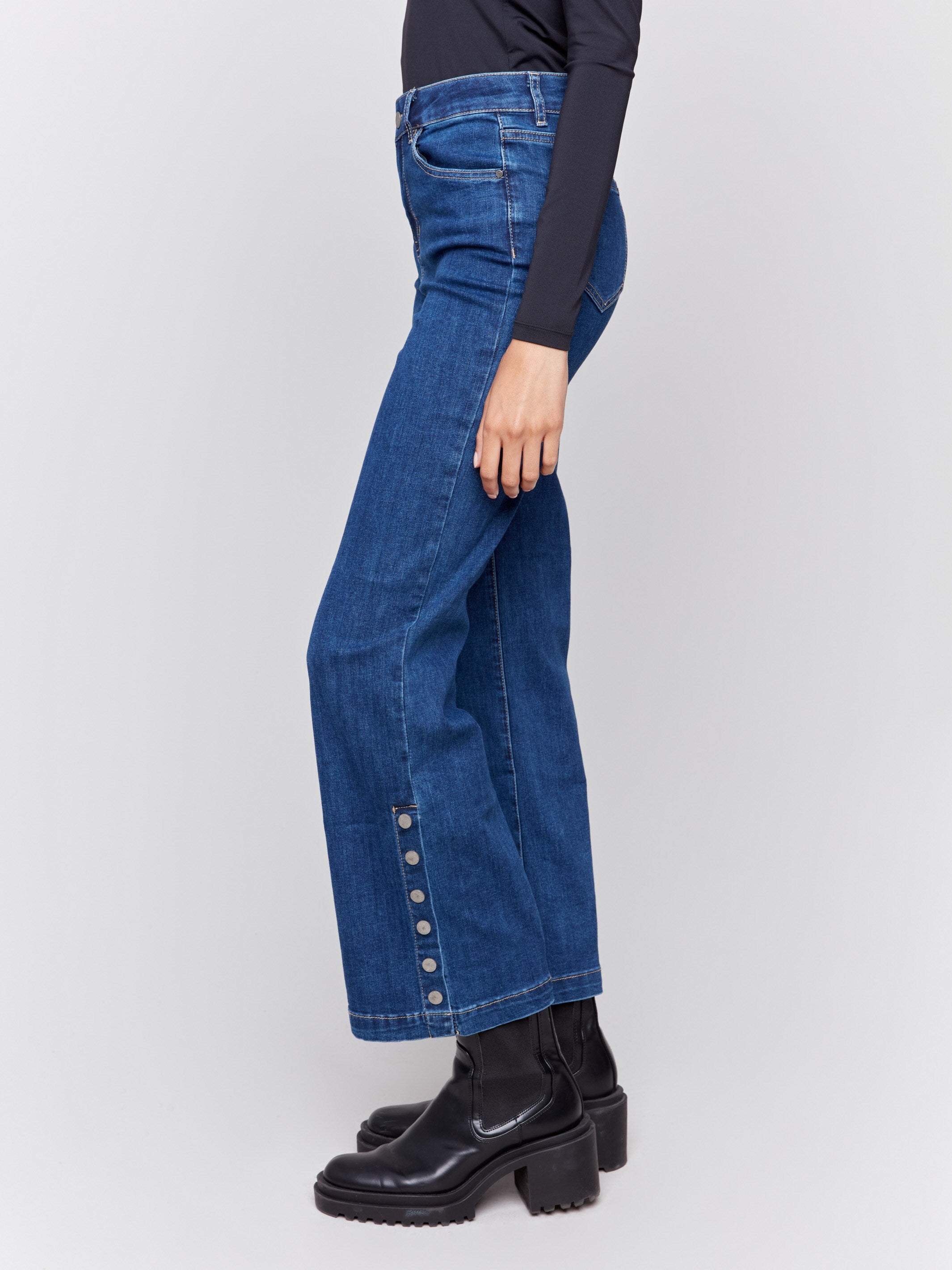 Indigo blue flare jeans with side button detailing, featuring a regular rise and classic five-pocket design by Charlie B.