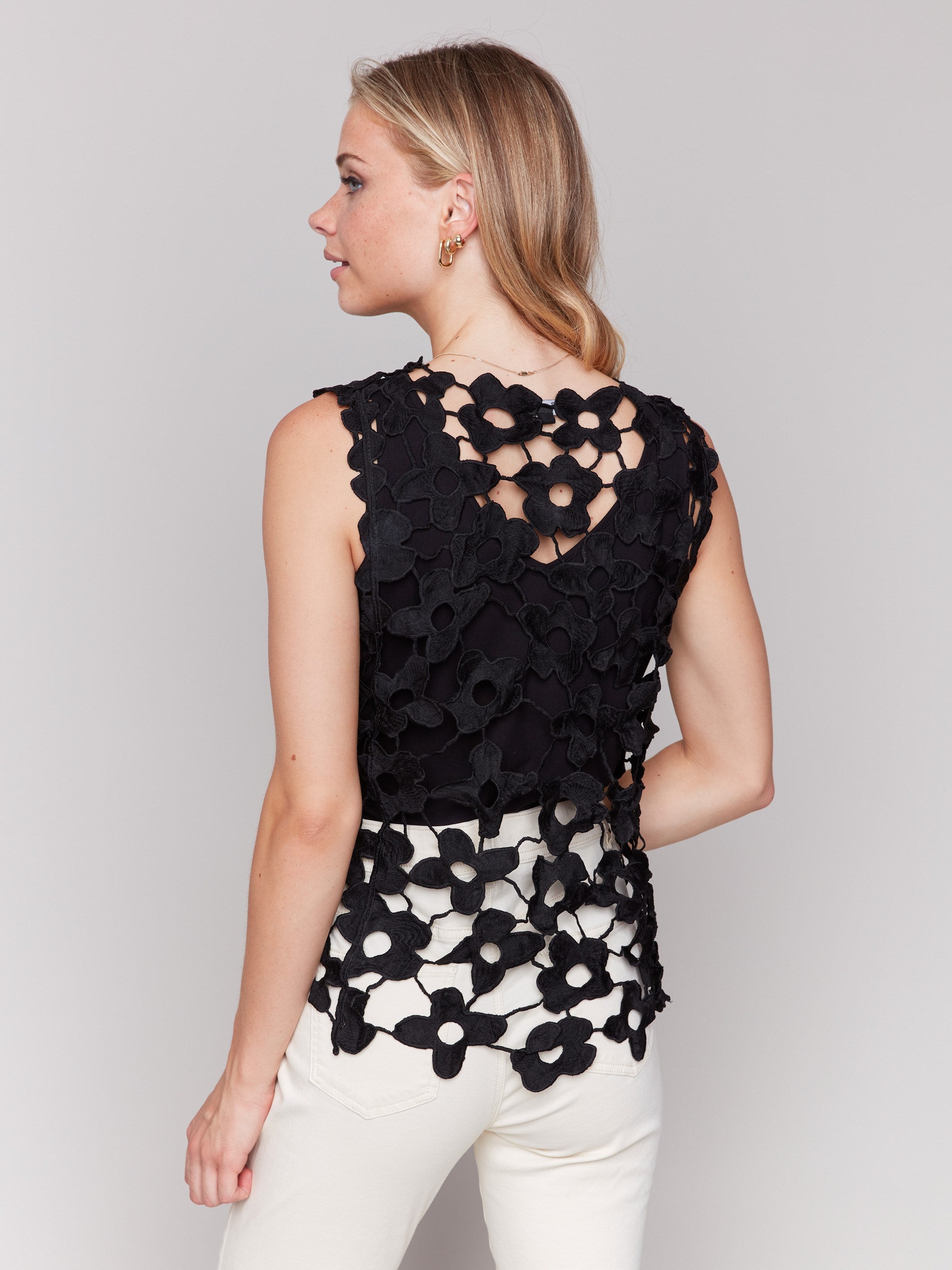 Stylish black crochet top highlighting its sleeveless design by Charlie B.