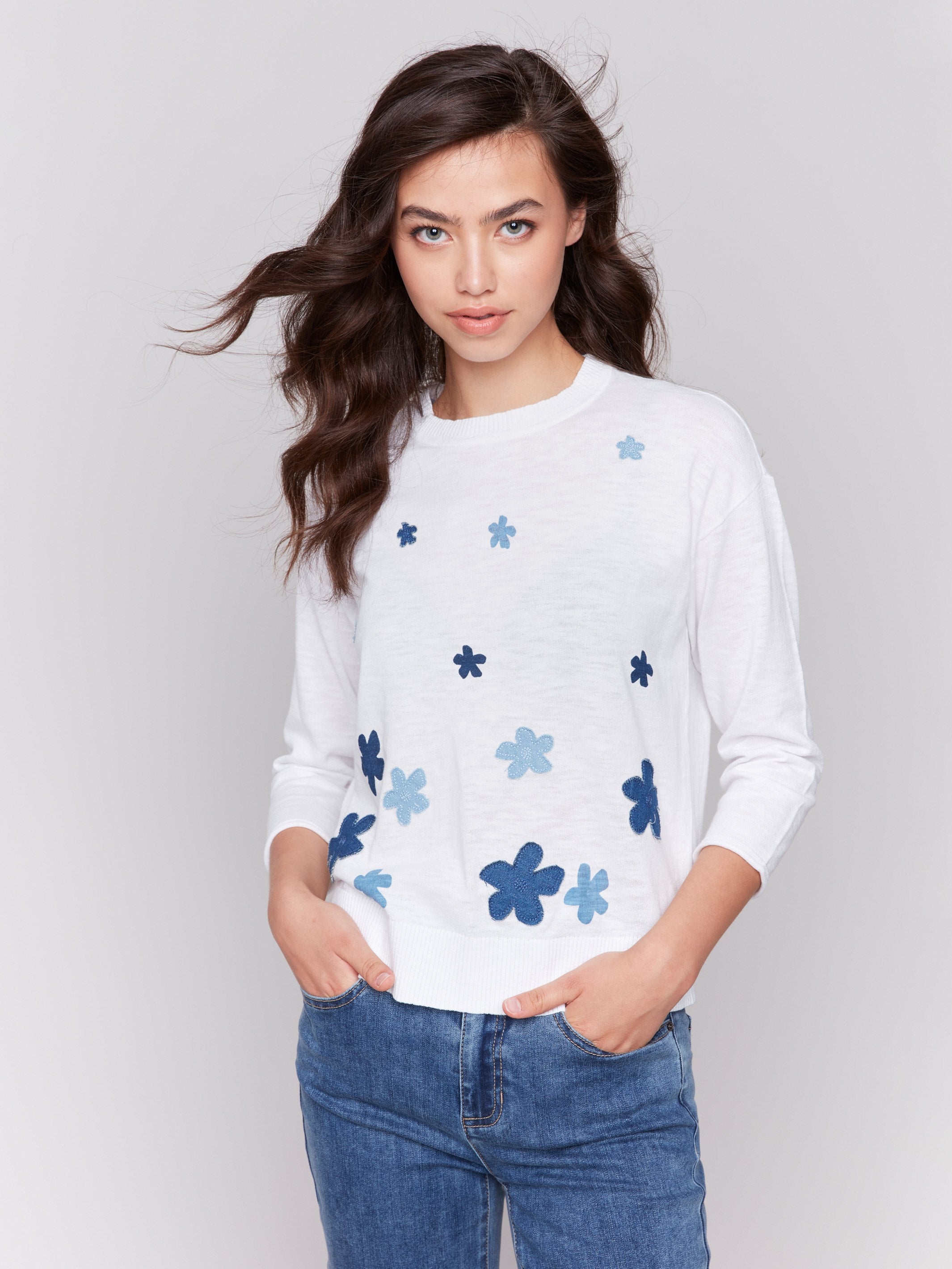 Cotton sweater with crew neckline and blue floral denim patches by Charlie B.