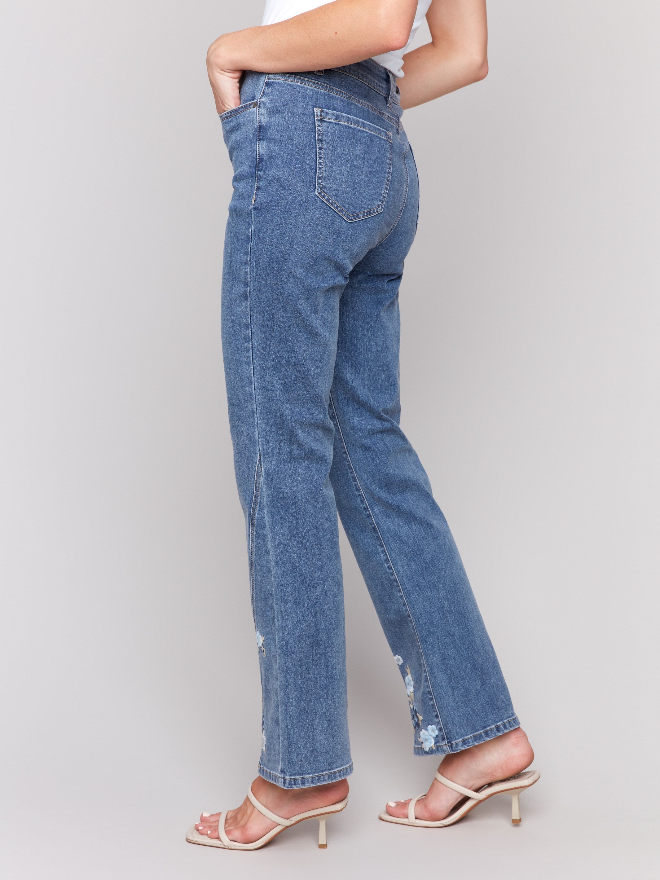 Medium blue jeans featuring regular rise waist by Charlie B.