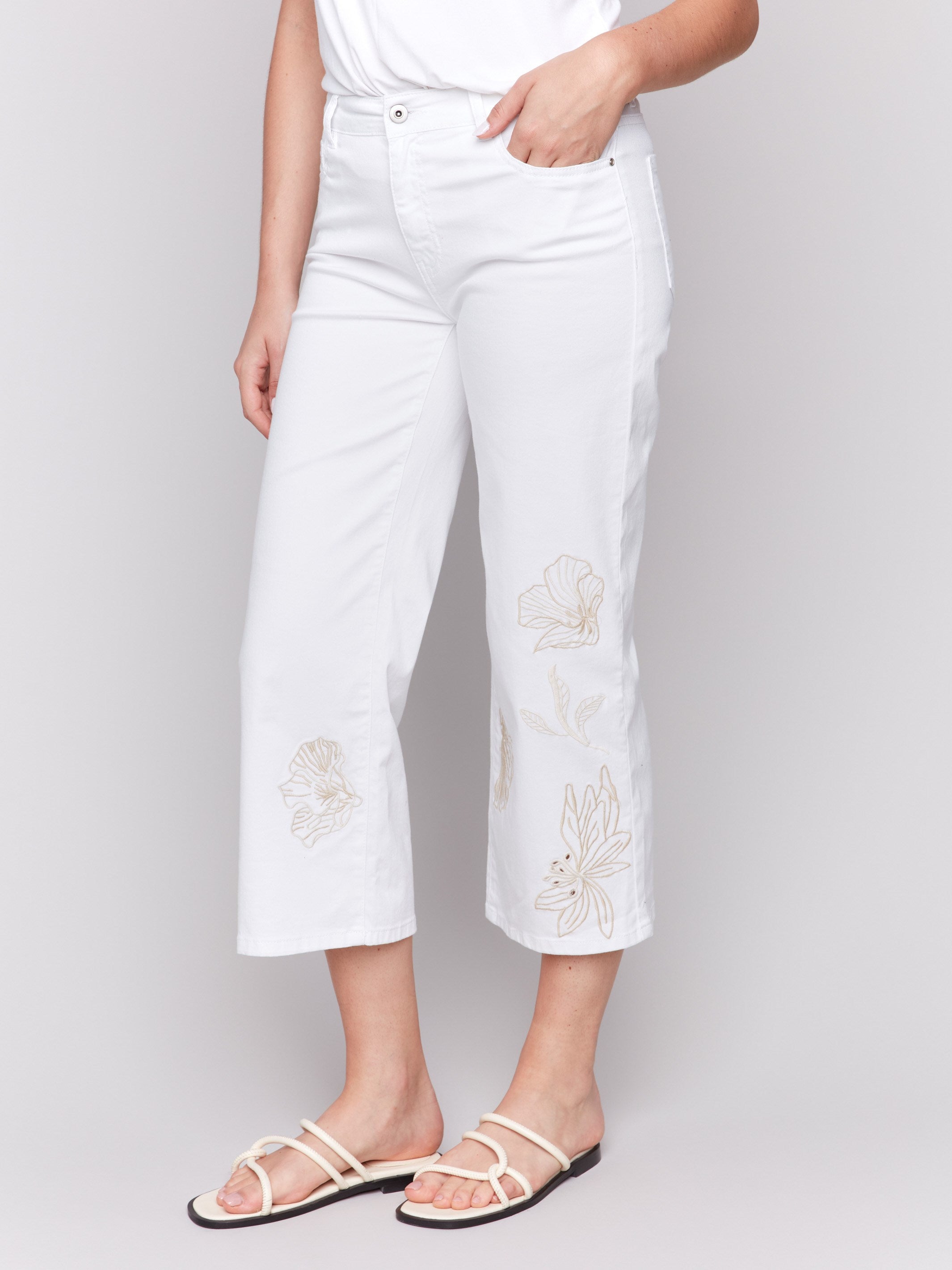 Elegant white pants with a regular rise and floral details by Charlie B.