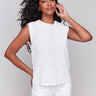 White cotton top with a crew neckline and floral embroidery by Charlie B.