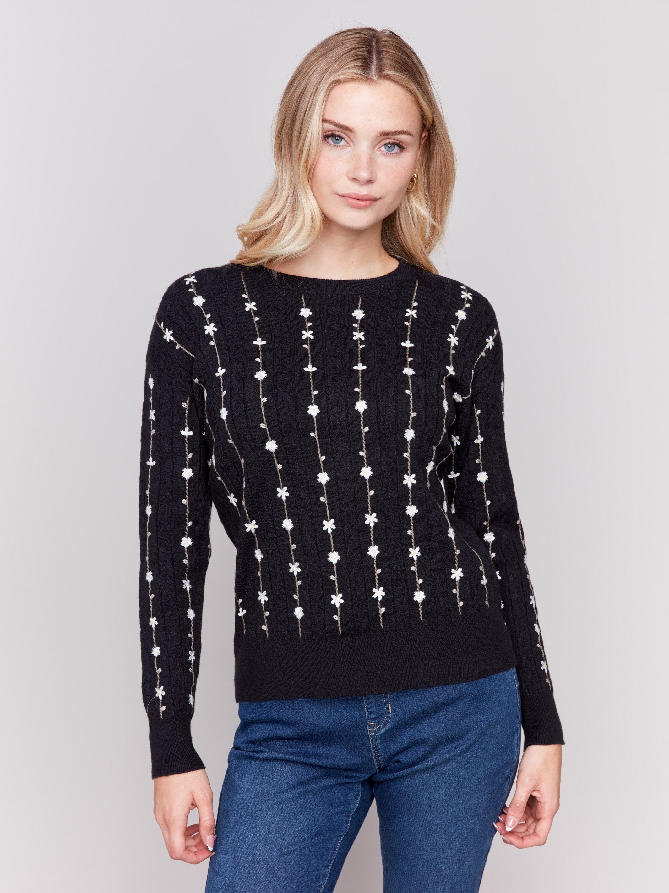 Black plushy knit sweater with floral embroidery, crew neck, and long sleeves by Charlie B.