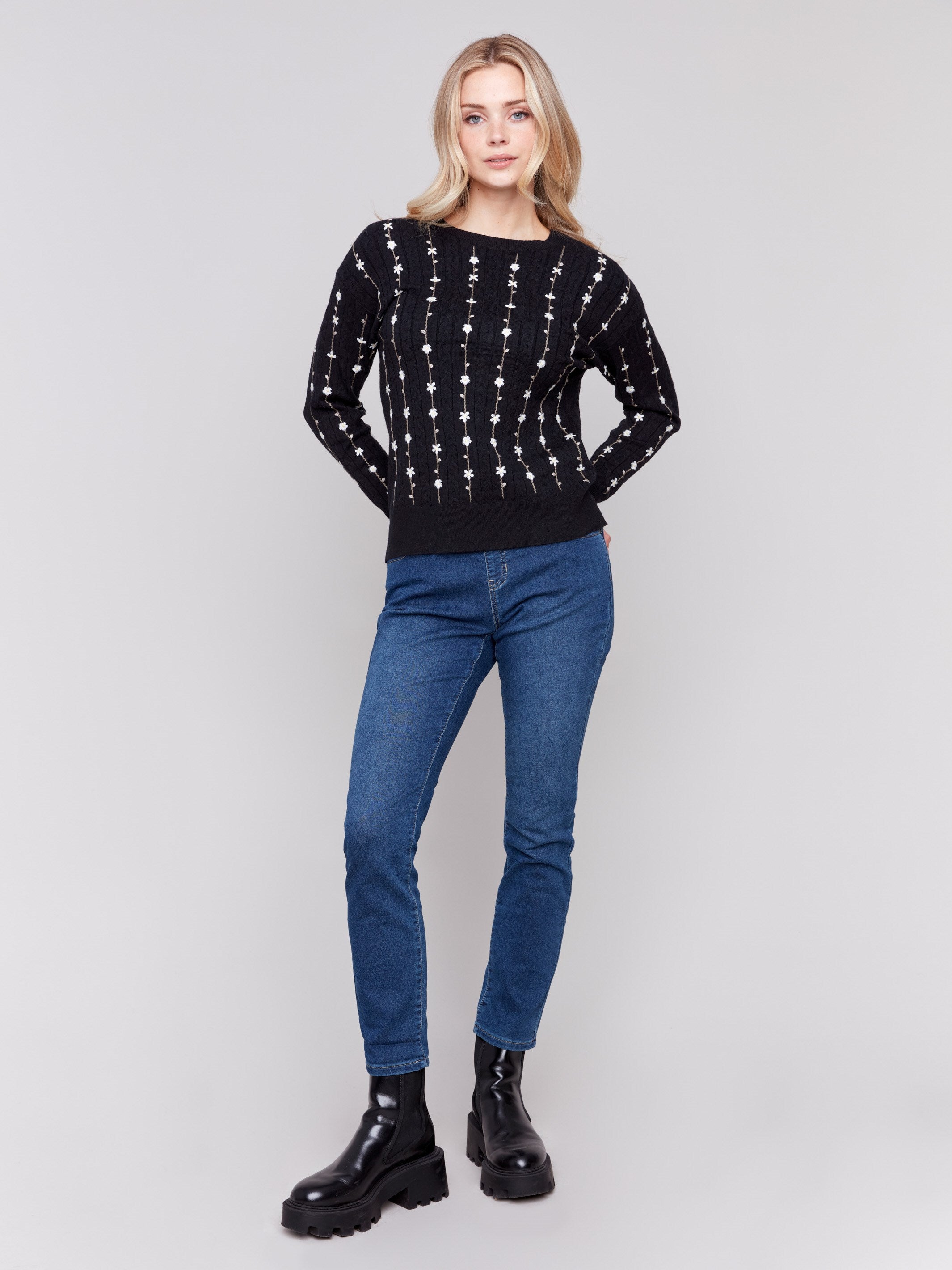 Black plushy knit sweater with floral embroidery, crew neck, and long sleeves by Charlie B.