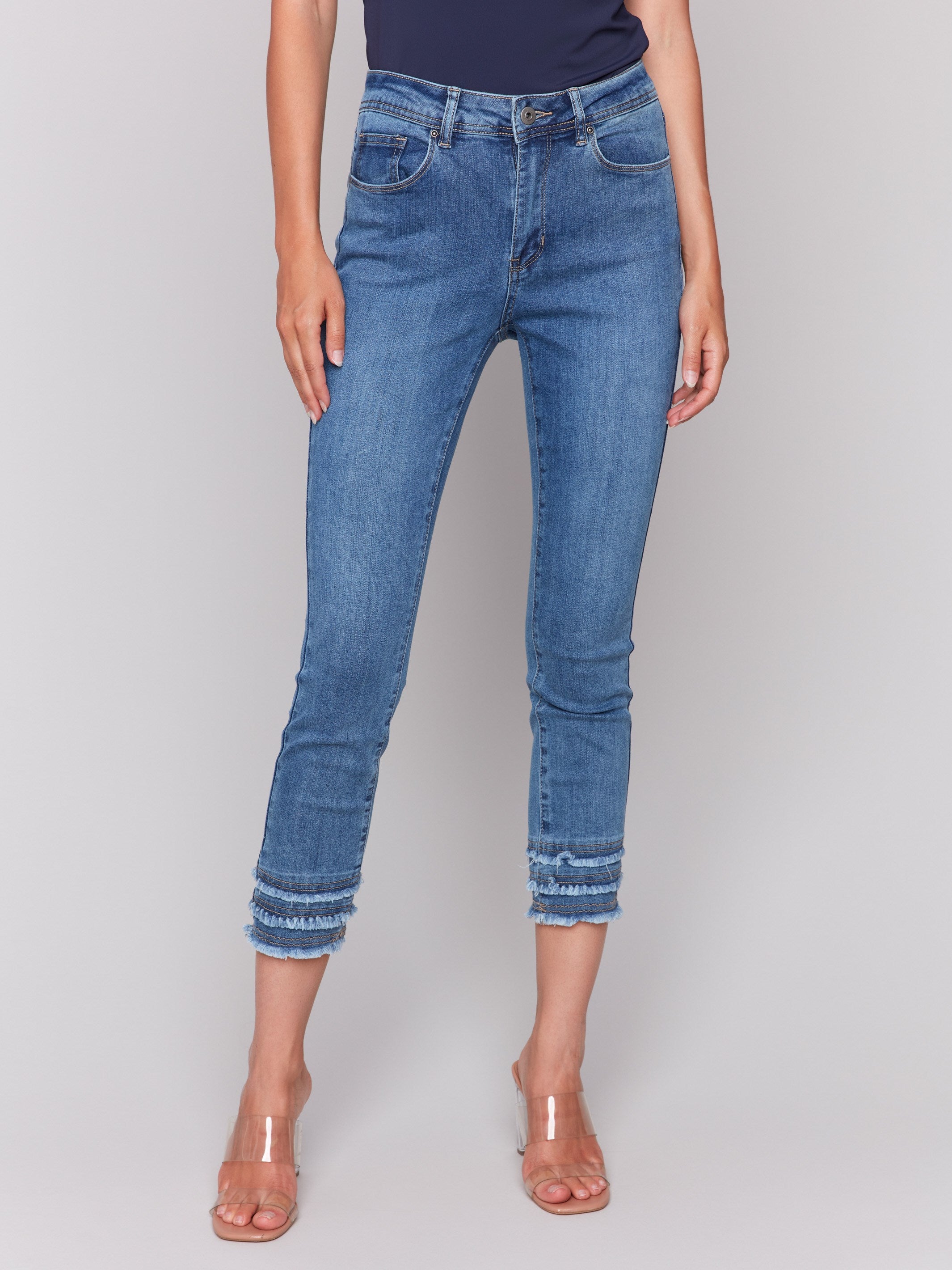 Medium blue denim pants featuring stretch twill fabric by Charlie B.