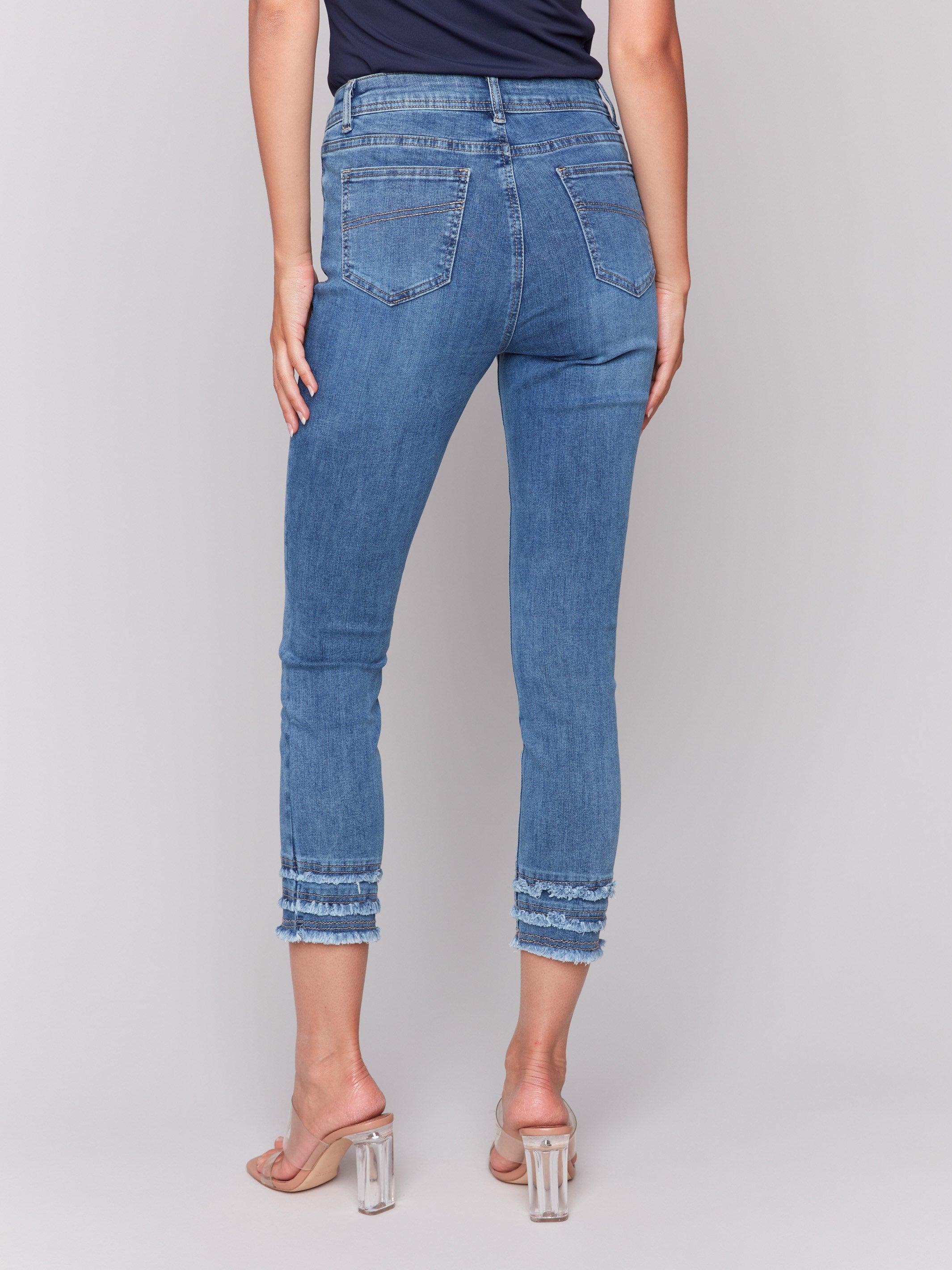 Denim pants in medium blue with a skinny fit style by Charlie B.