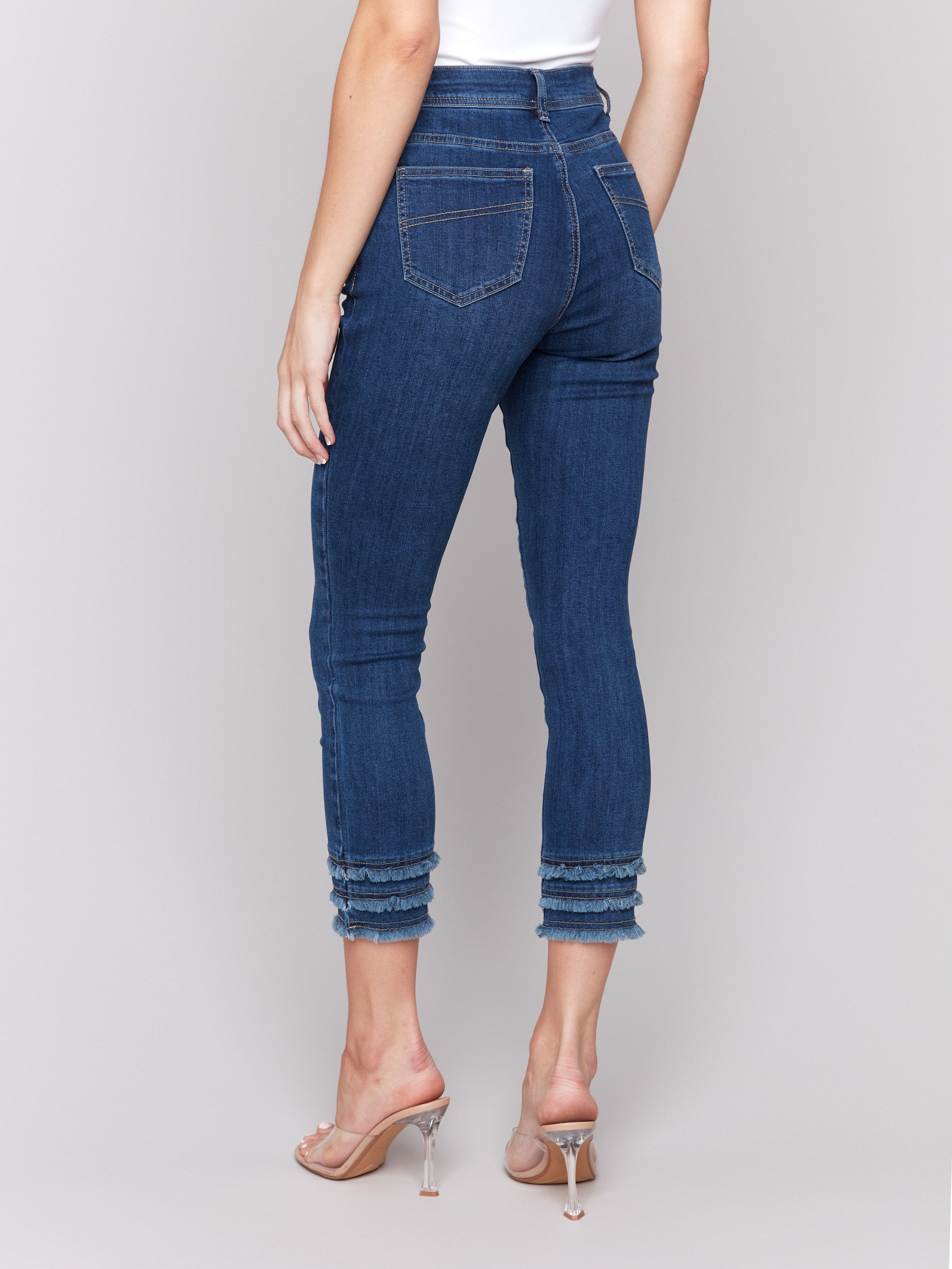 Denim cropped pants featuring a frayed hem detail by Charlie B.