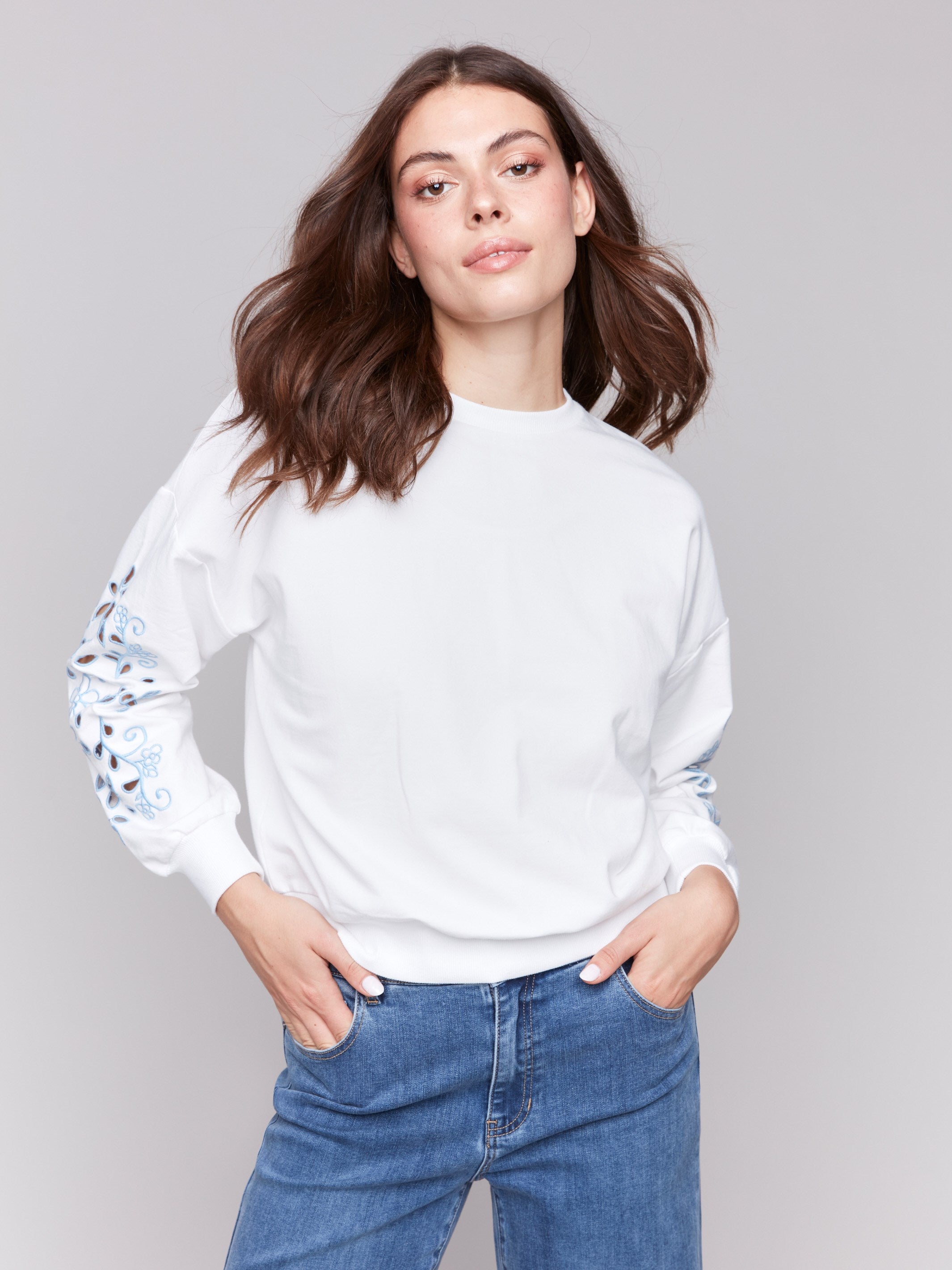 White sweatshirt with crew neckline, featuring French Terry fabric by Charlie B.