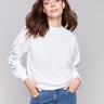 White sweatshirt featuring a crew neckline, crafted from premium fabric by Charlie B.