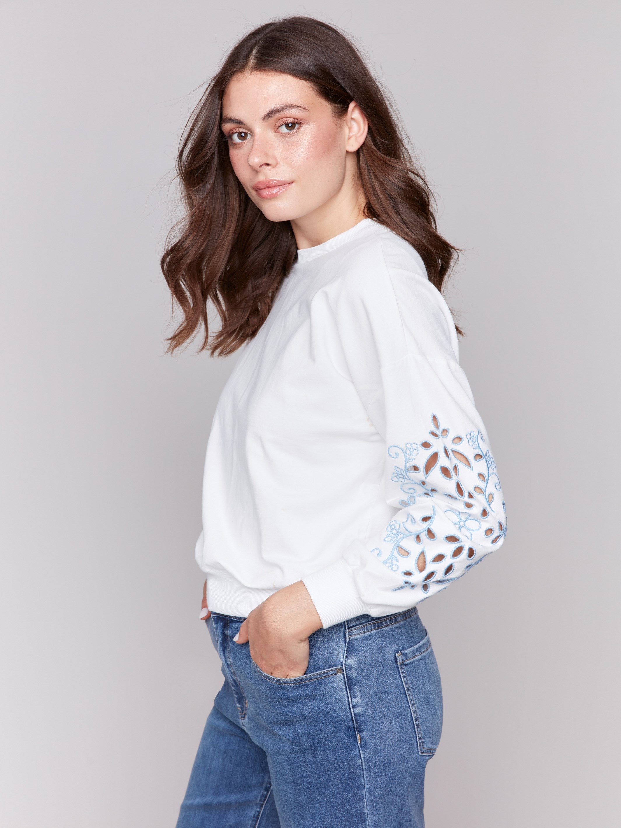 French Terry fabric adds softness to this elegant white sweatshirt by Charlie B.