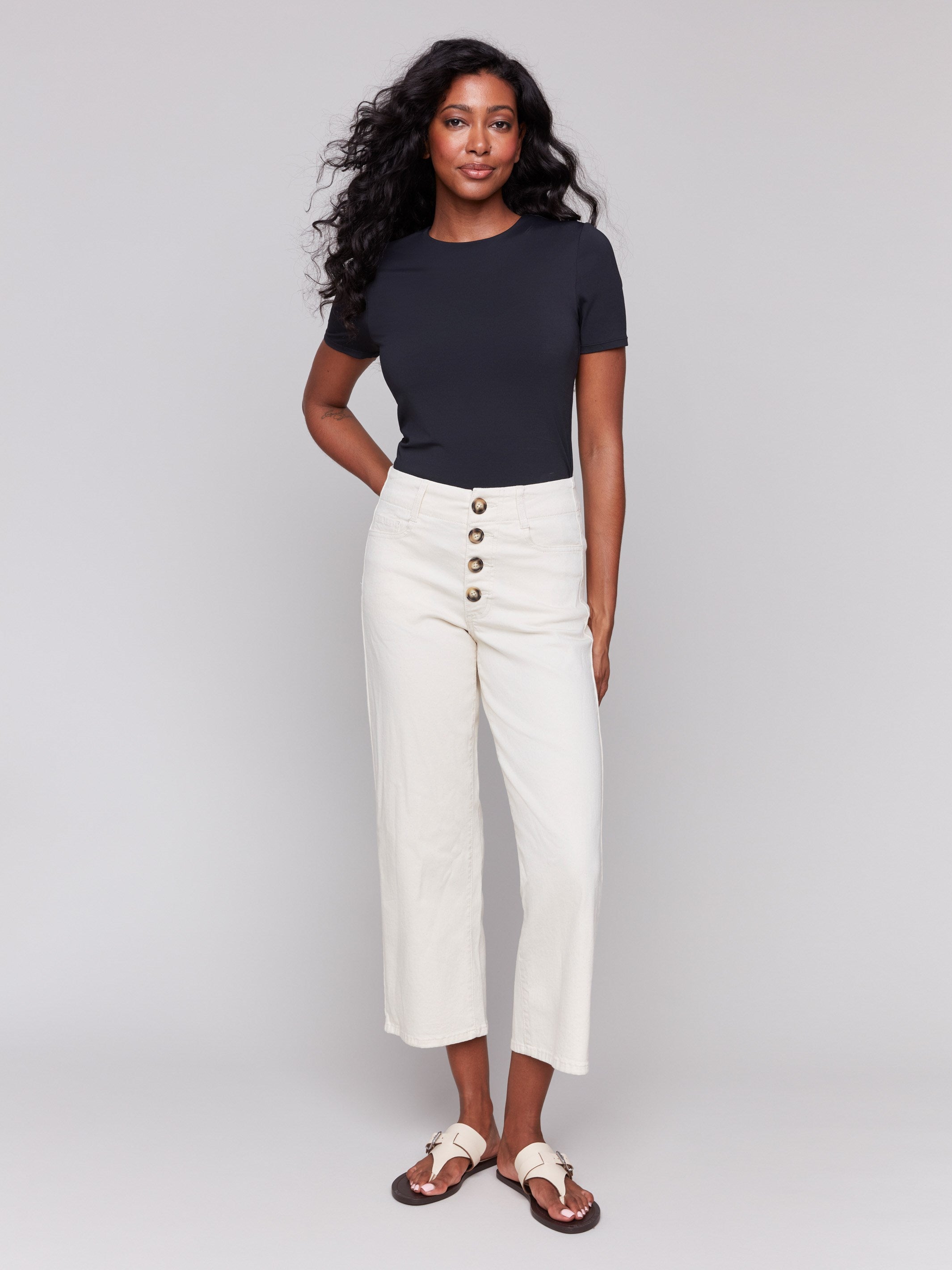 Natural color cropped length twill pants with a five-pocket design by Charlie B.