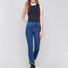 Indigo blue denim jeans with a tulip hem and bootcut design by Charlie B. Featuring a mid-rise and frayed hem details.