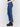 Indigo blue denim jeans with a tulip hem and bootcut design by Charlie B. Featuring a mid-rise and frayed hem details.