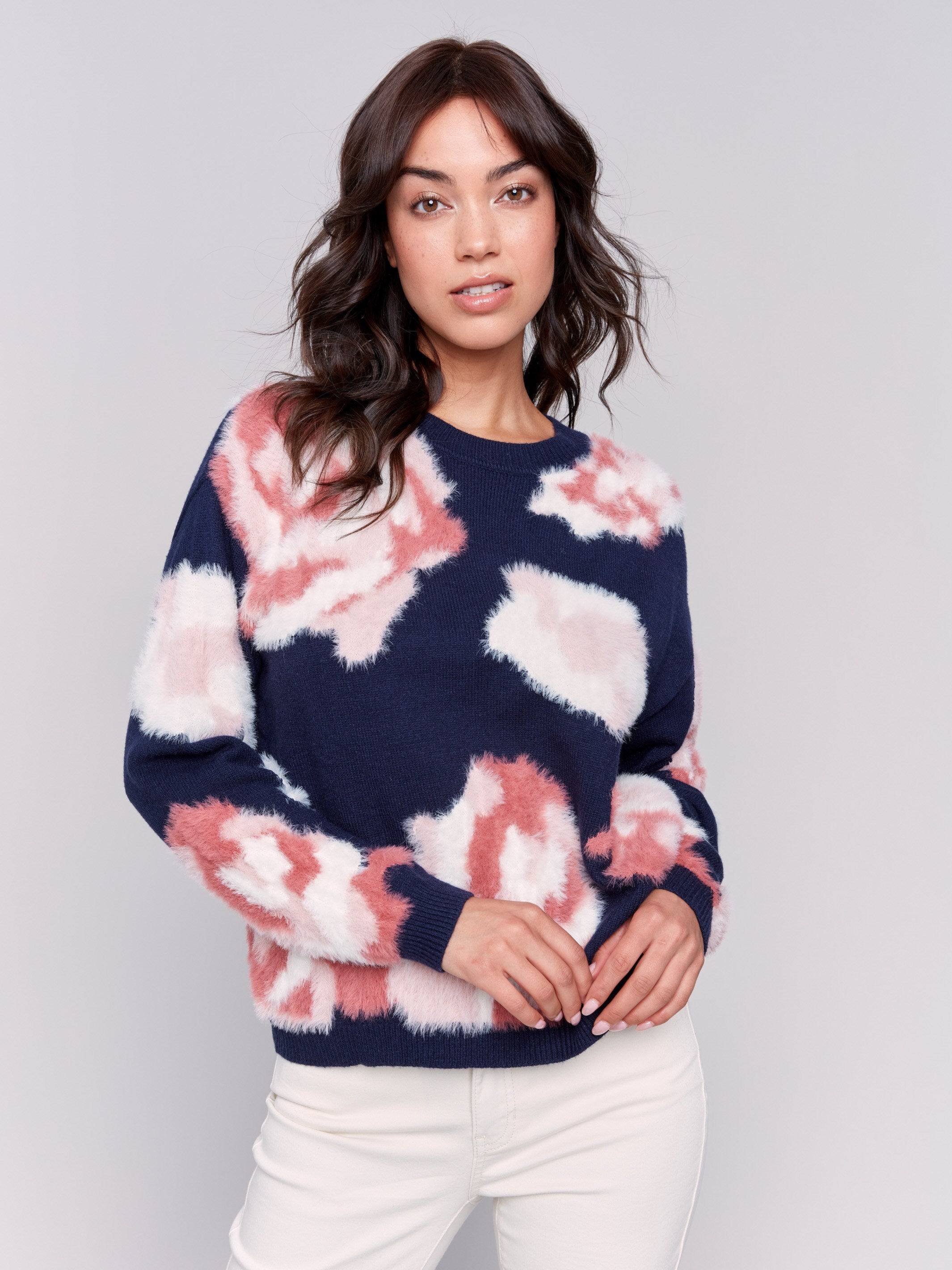 Navy fuzzy jacquard knit sweater with a floral pink pattern, featuring a crew neck and drop-shoulder design by Charlie B.