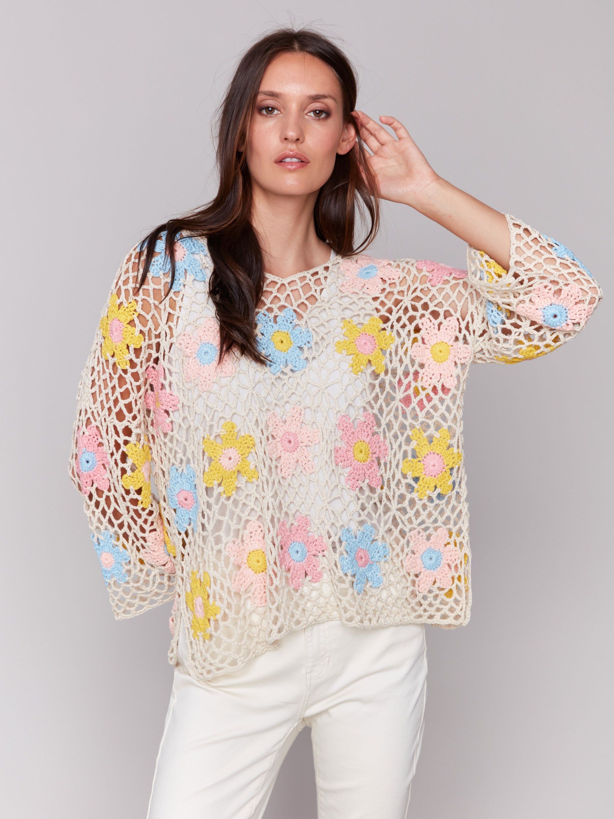 Natural floral crochet top with V-neck detail, highlighting its unique style by Charlie B.