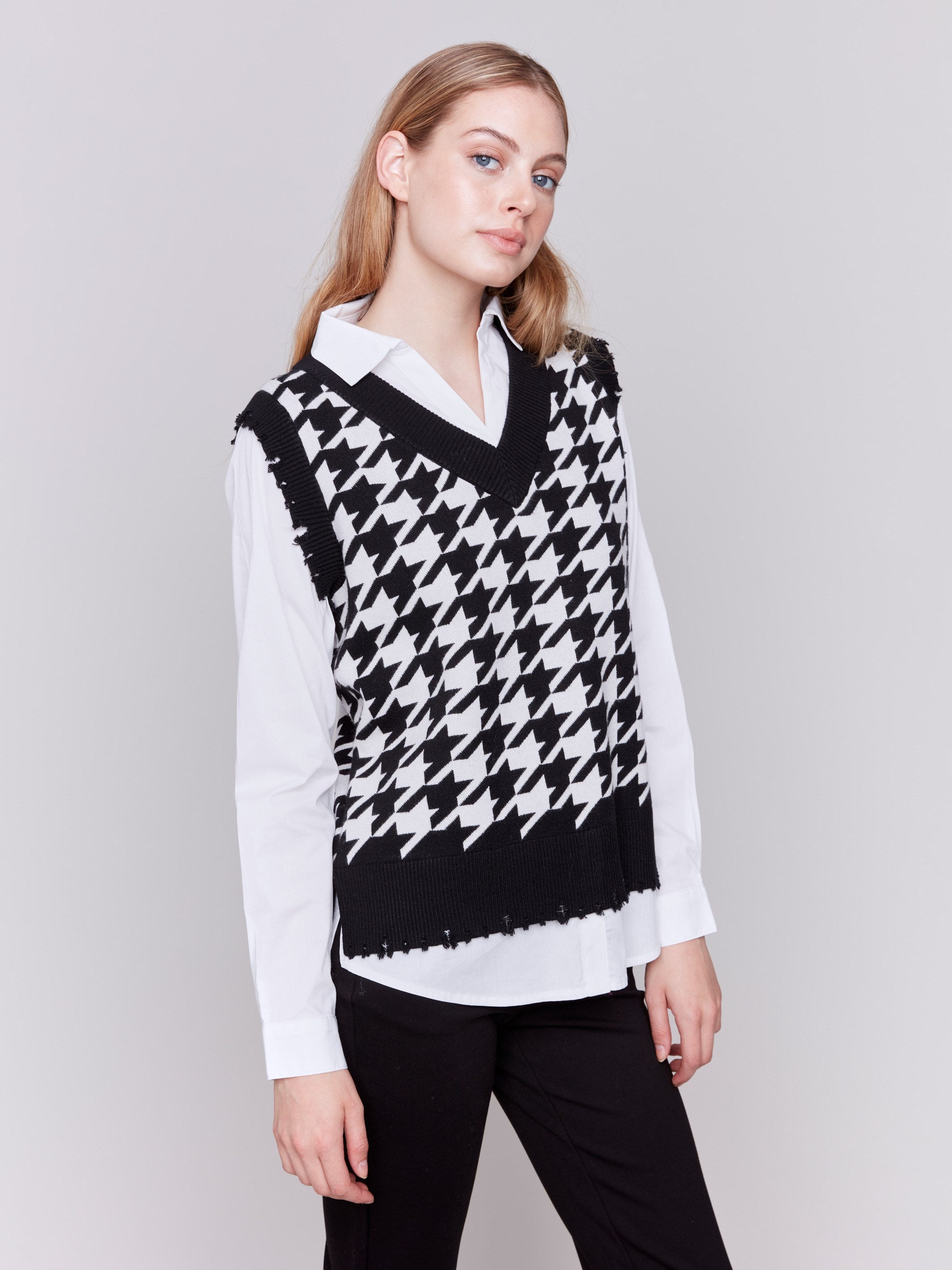 Black and white houndstooth fooler vest with v-neck and poplin shirt collar, hem, and sleeves by Charlie B.