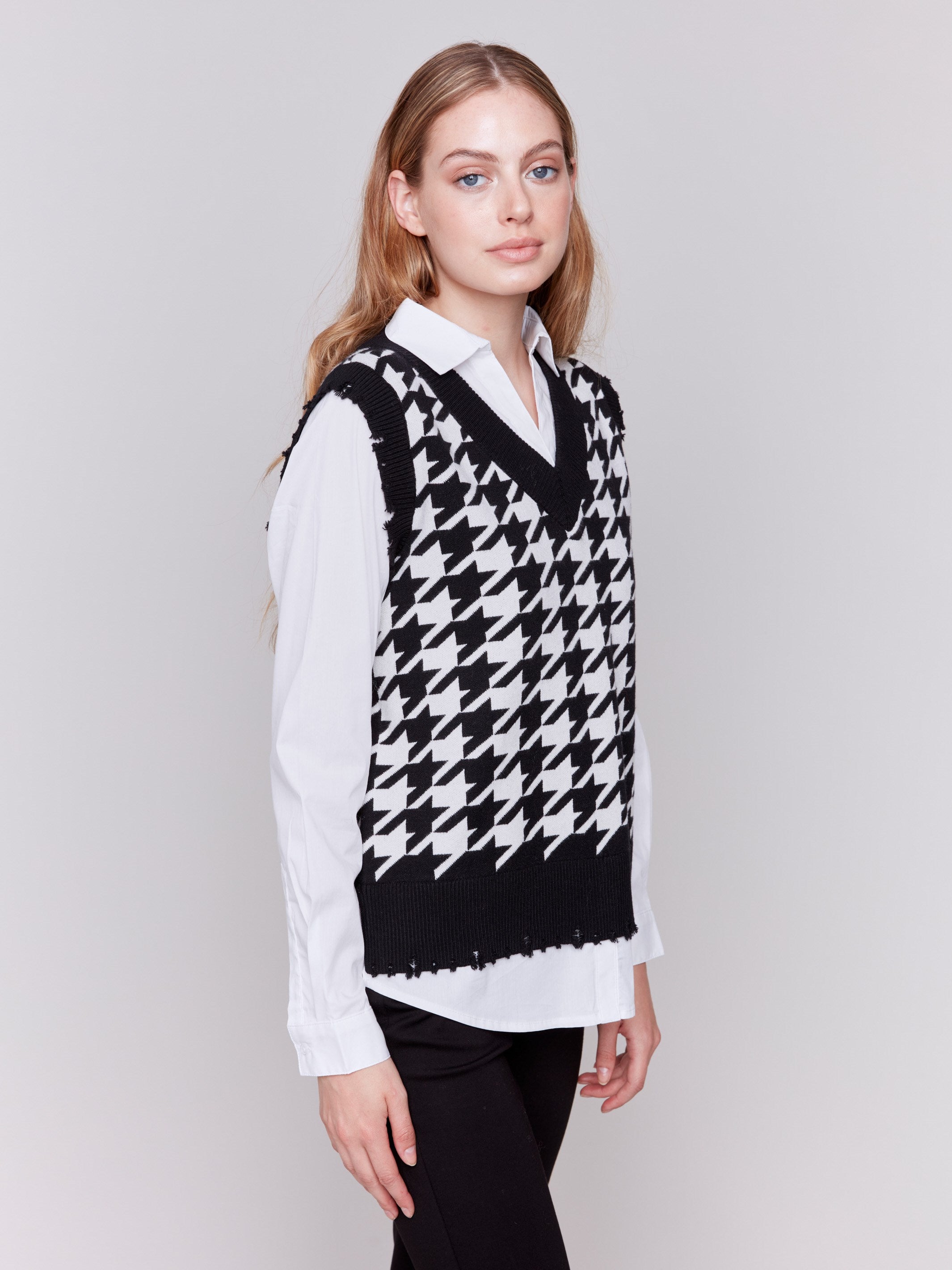 Black and white houndstooth fooler vest with v-neck and poplin shirt collar, hem, and sleeves by Charlie B.