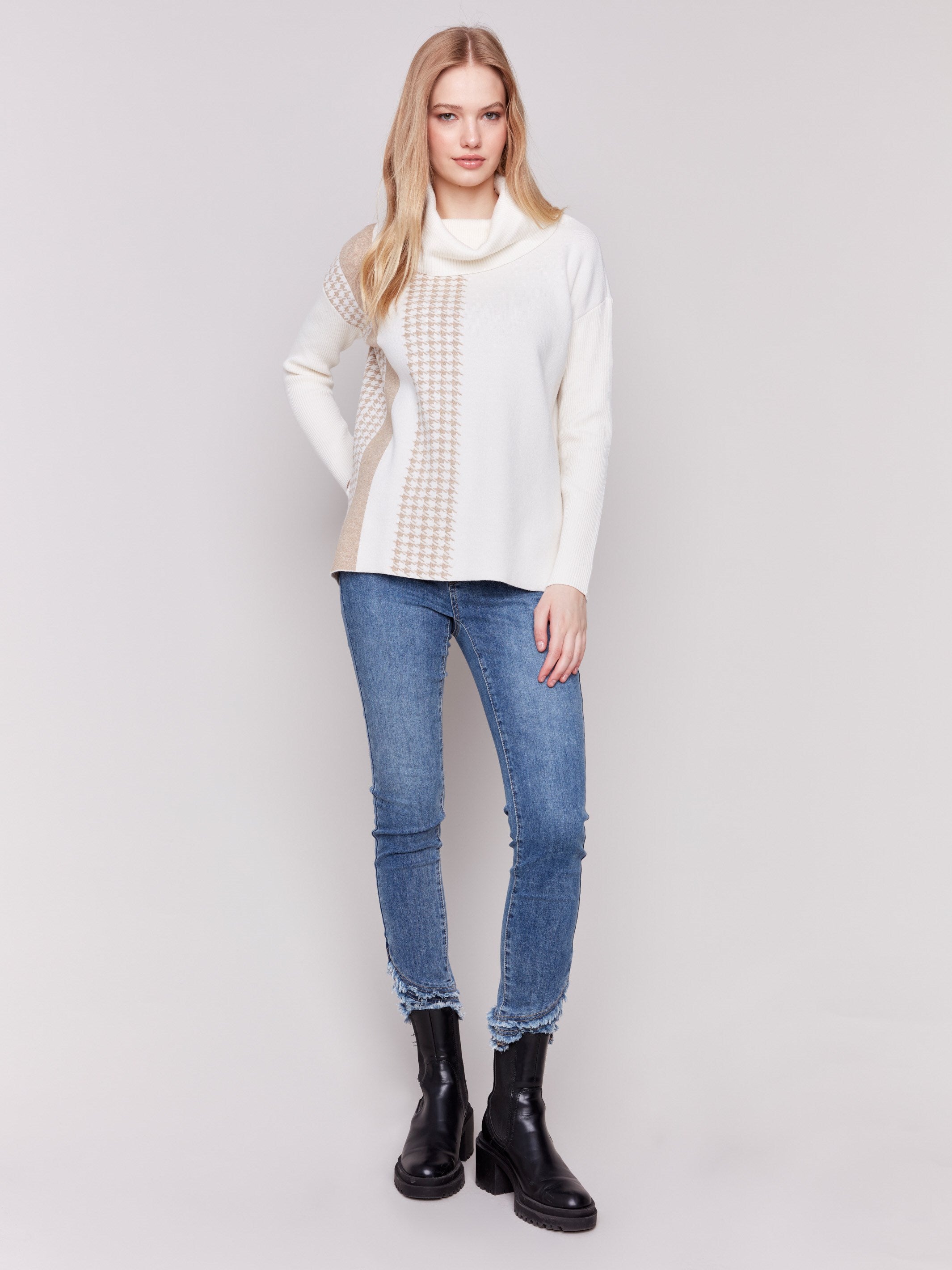 Ecru sweater with a houndstooth stripe, featuring a cowl neck and side slit by Charlie B.