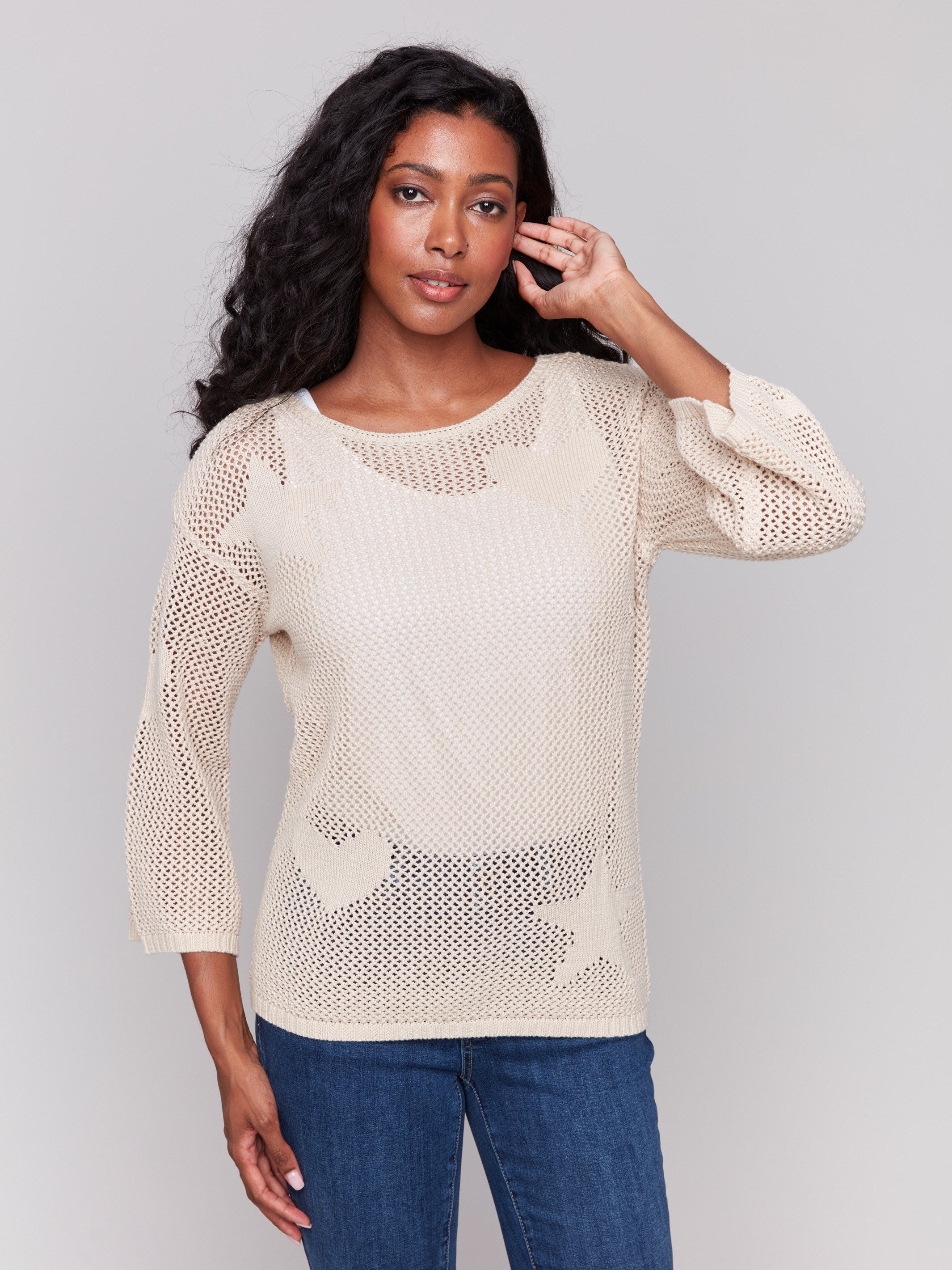 Crochet sweater with a round neckline and intricate patterns by Charlie B.