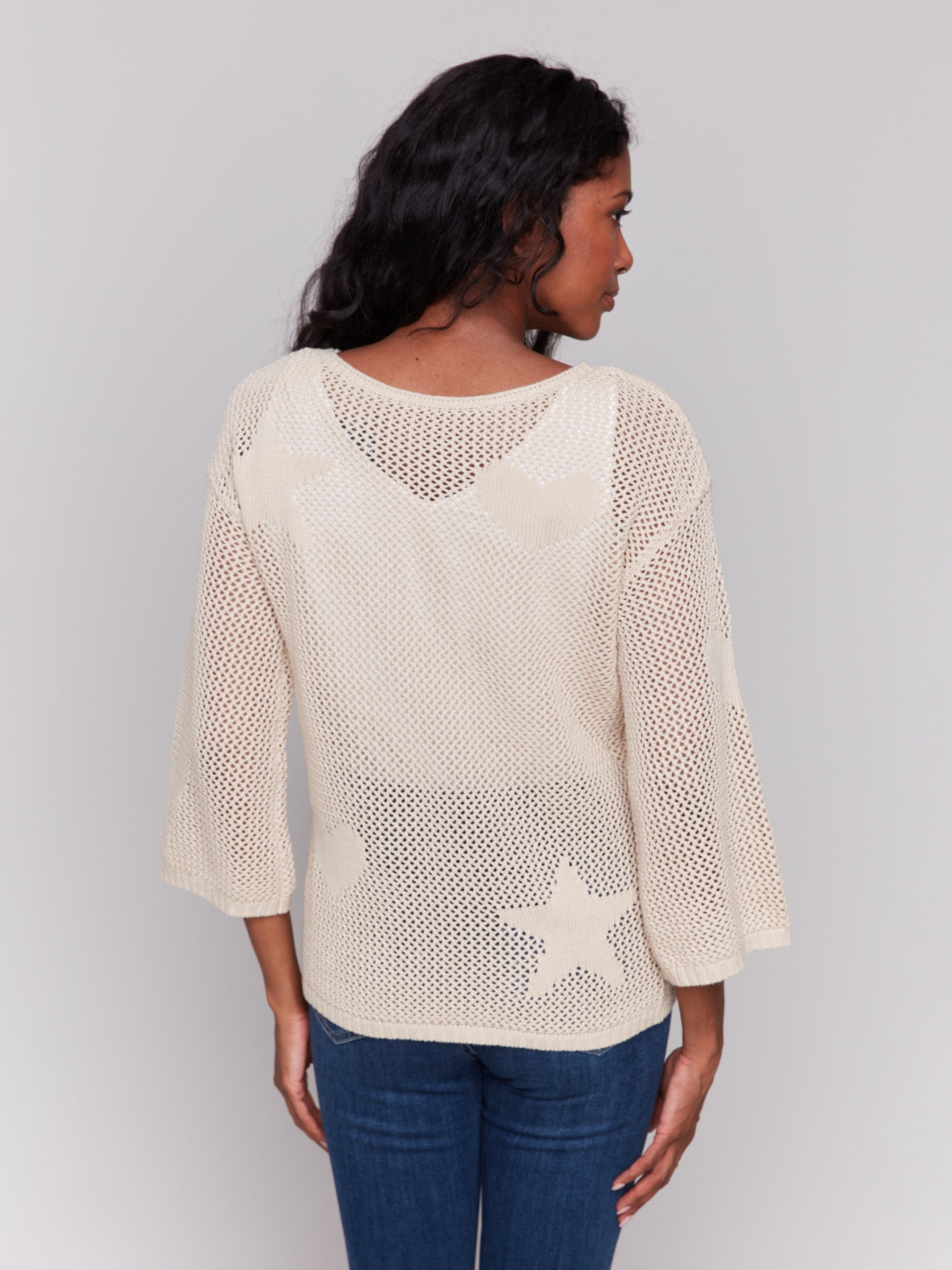 Sweater featuring hearts and stars pattern, ideal for casual outings by Charlie B.