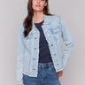 Bleach blue denim jacket with frayed edges and front pockets by Charlie B.