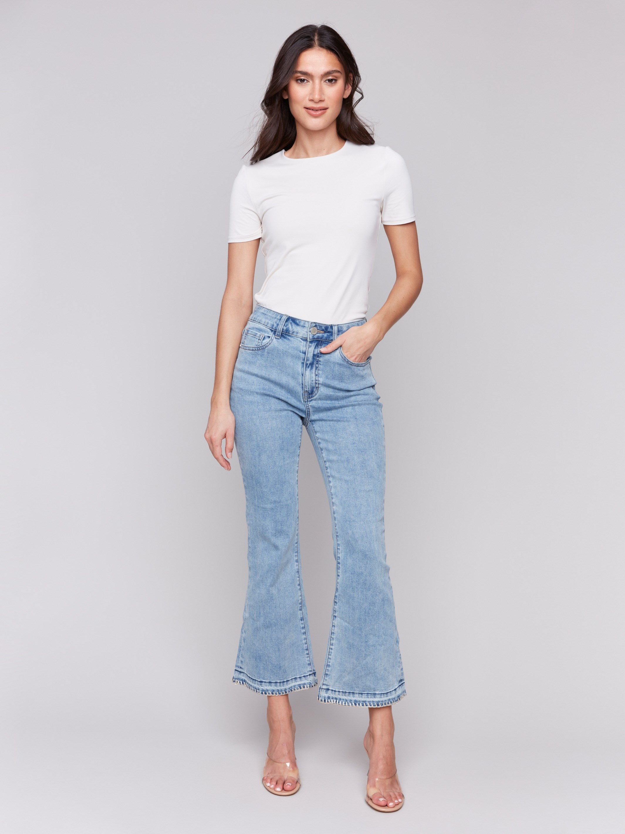 Stretch denim jeans with a blanket stitch hem detail by Charlie B.