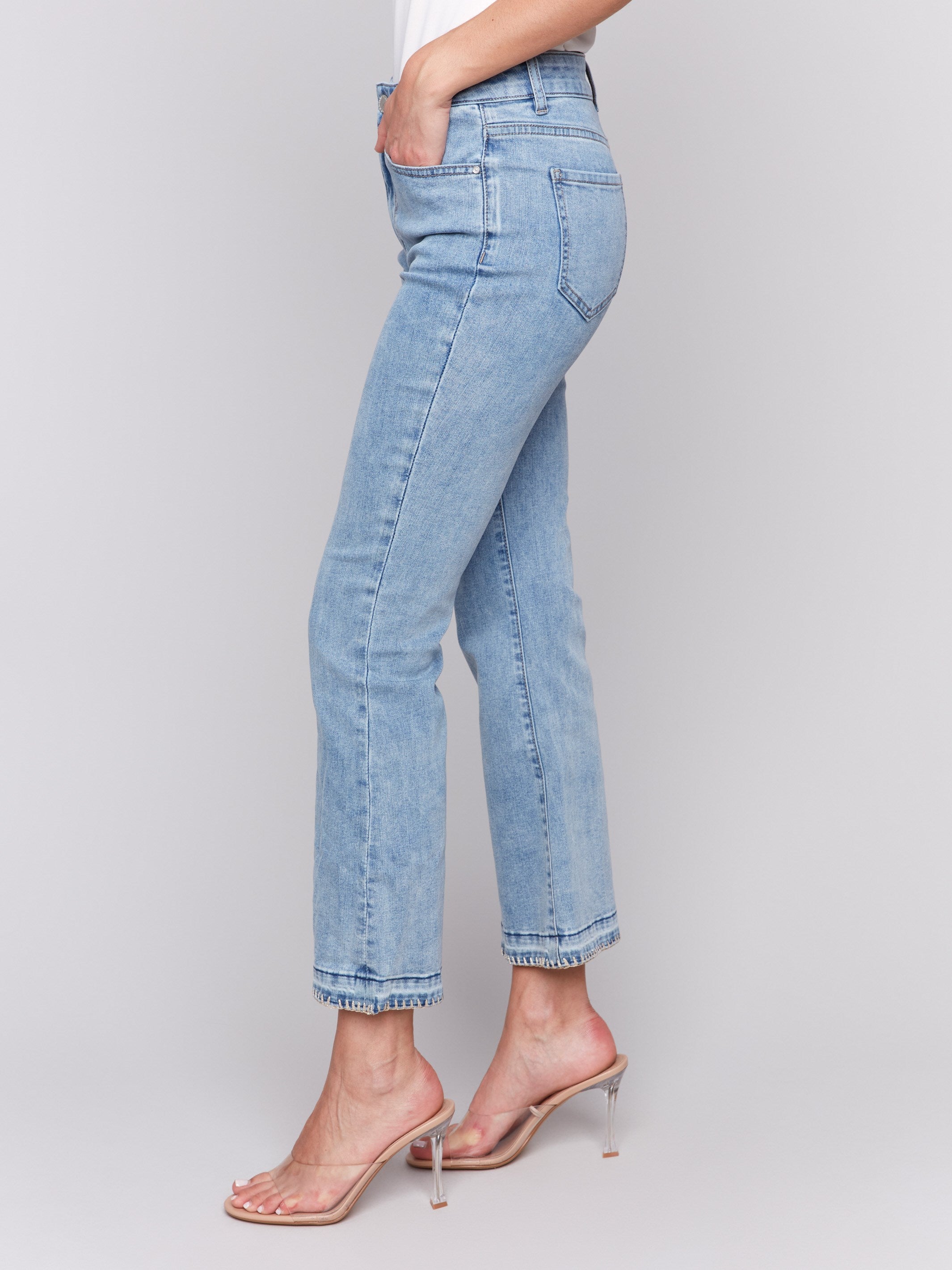 Light blue jeans featuring flare fit and stretch material by Charlie B.