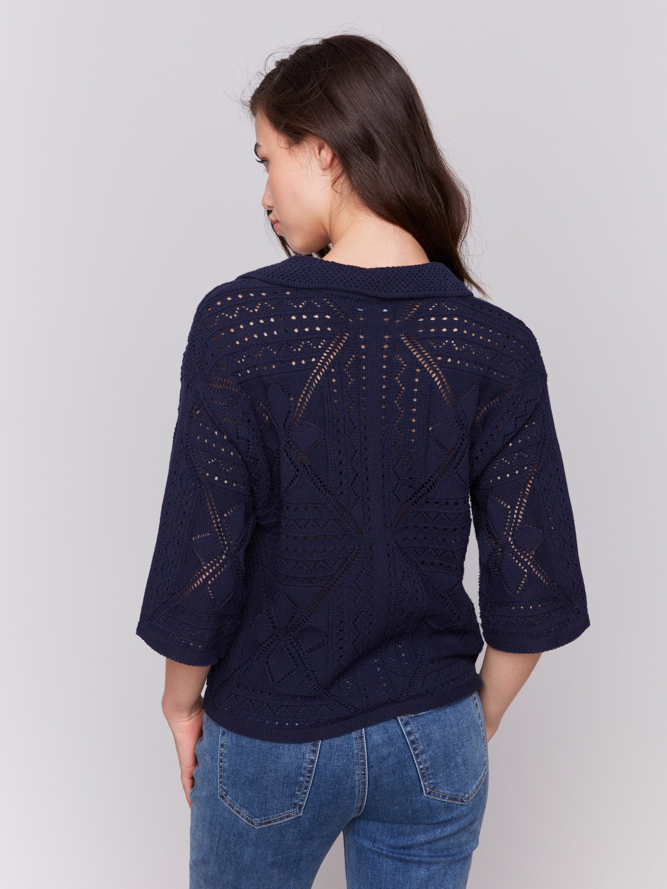 Elegant geometric design on this navy Johnny collar sweater by Charlie B.