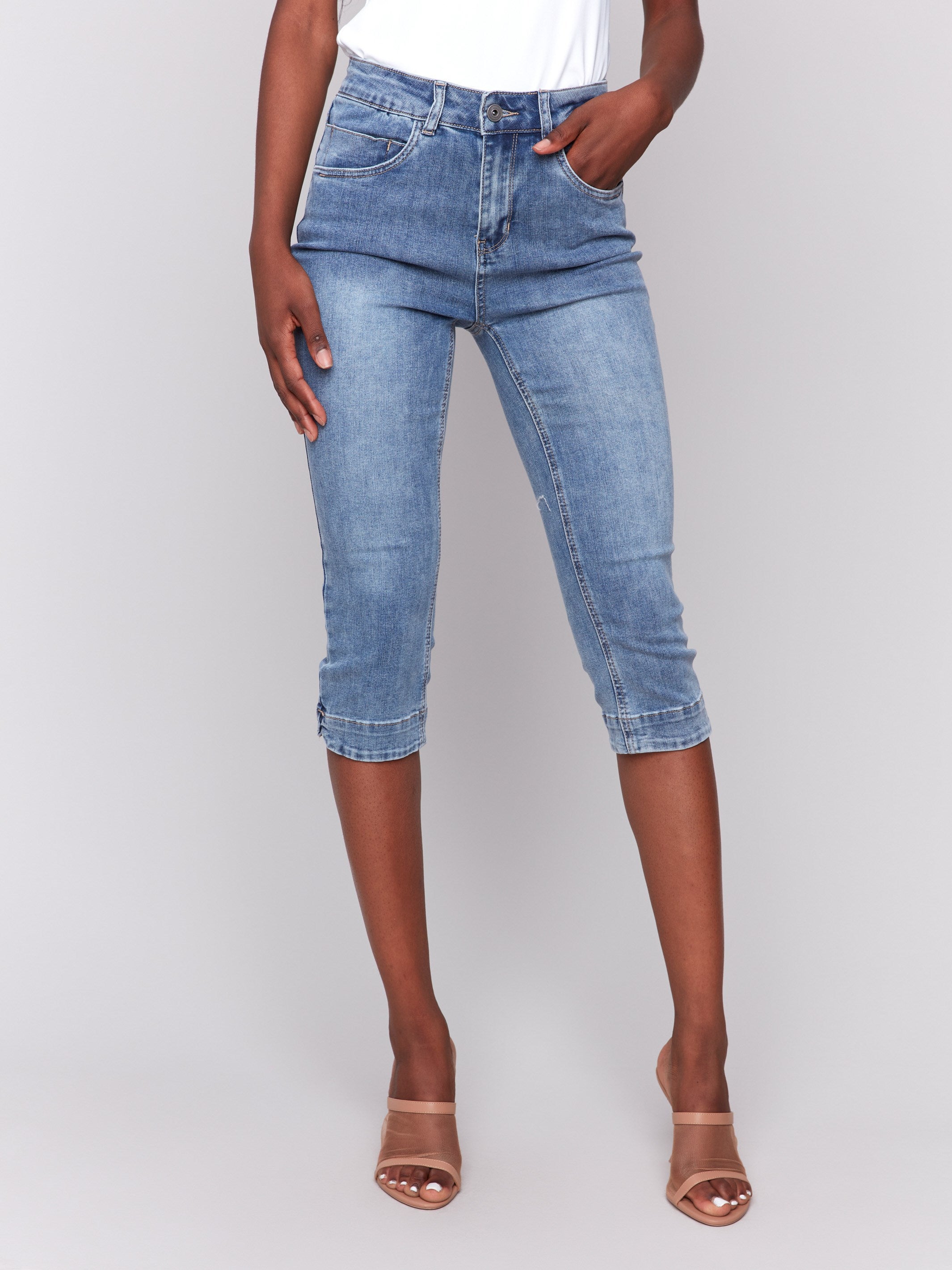 Stylish medium blue Capri jeans featuring a knee-high cropped design, ideal for summer outfits by Charlie B.