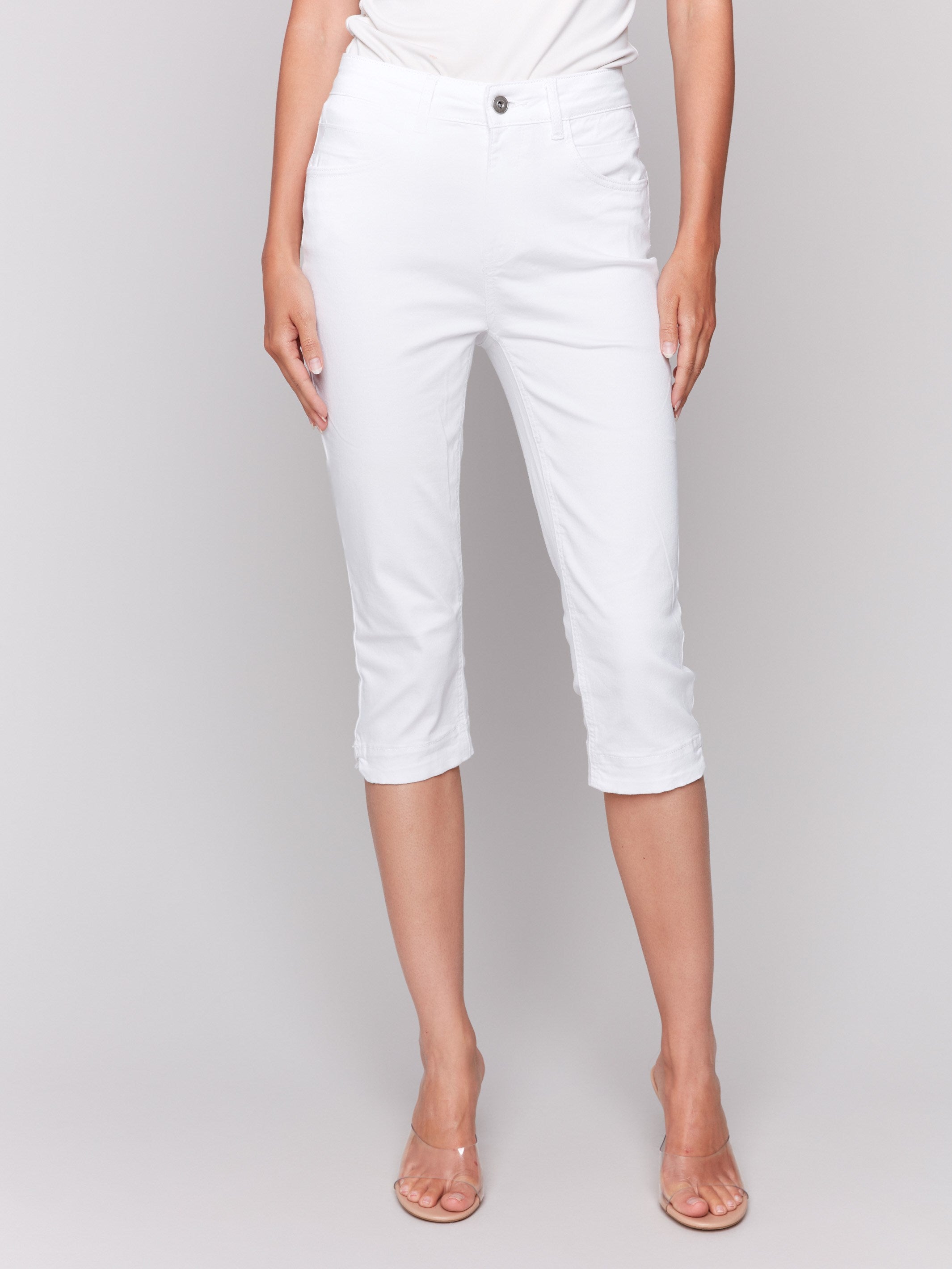 Slim-leg white capri pants featuring a stretch twill fabric by Charlie B.