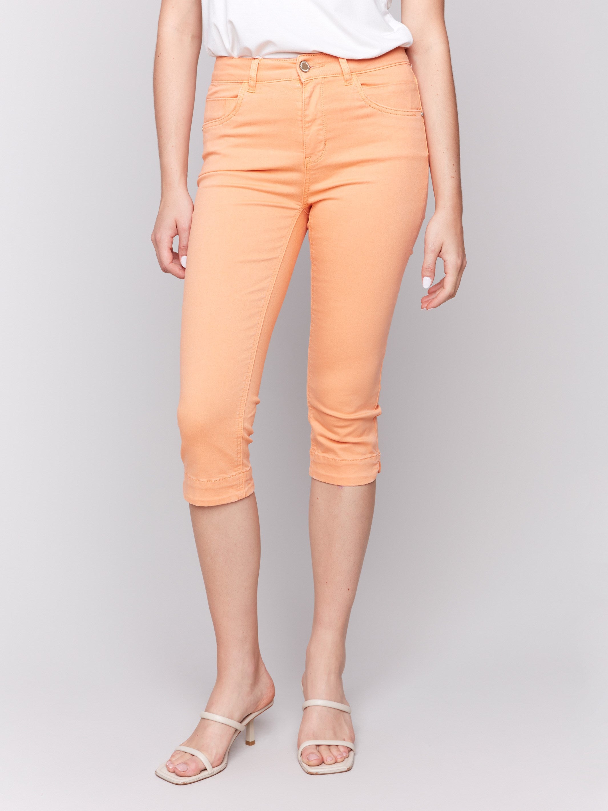 Papaya cropped pants with five-pocket styling and a knee-high design by Charlie B.